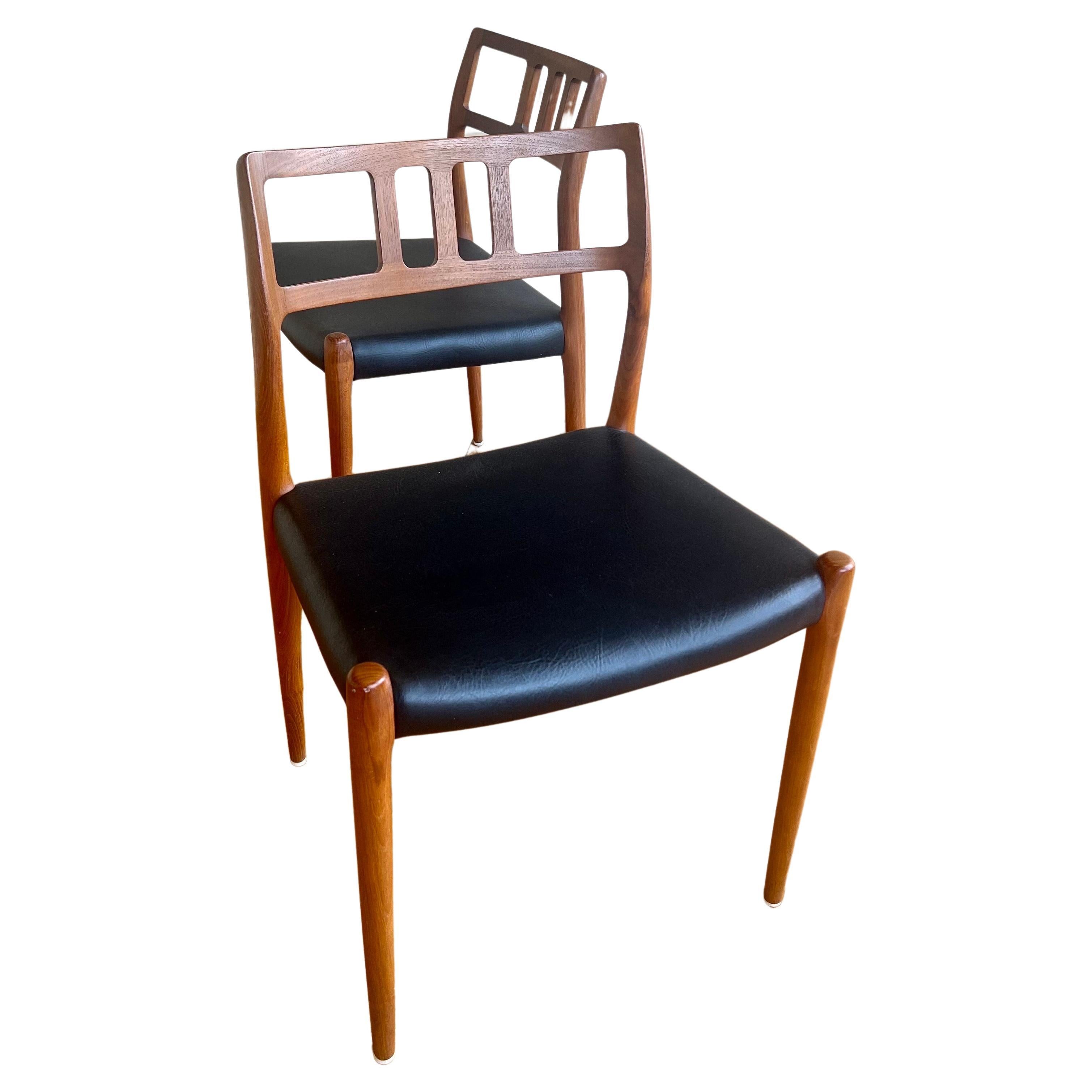 A very nice set of six teak dining chairs designed by Nils Moller, circa 1960s. The chairs are solid teak construction with black Naugahyde upholstered seats. The set is in very good condition. solid and sturdy very light wear.Model 79 Chair by