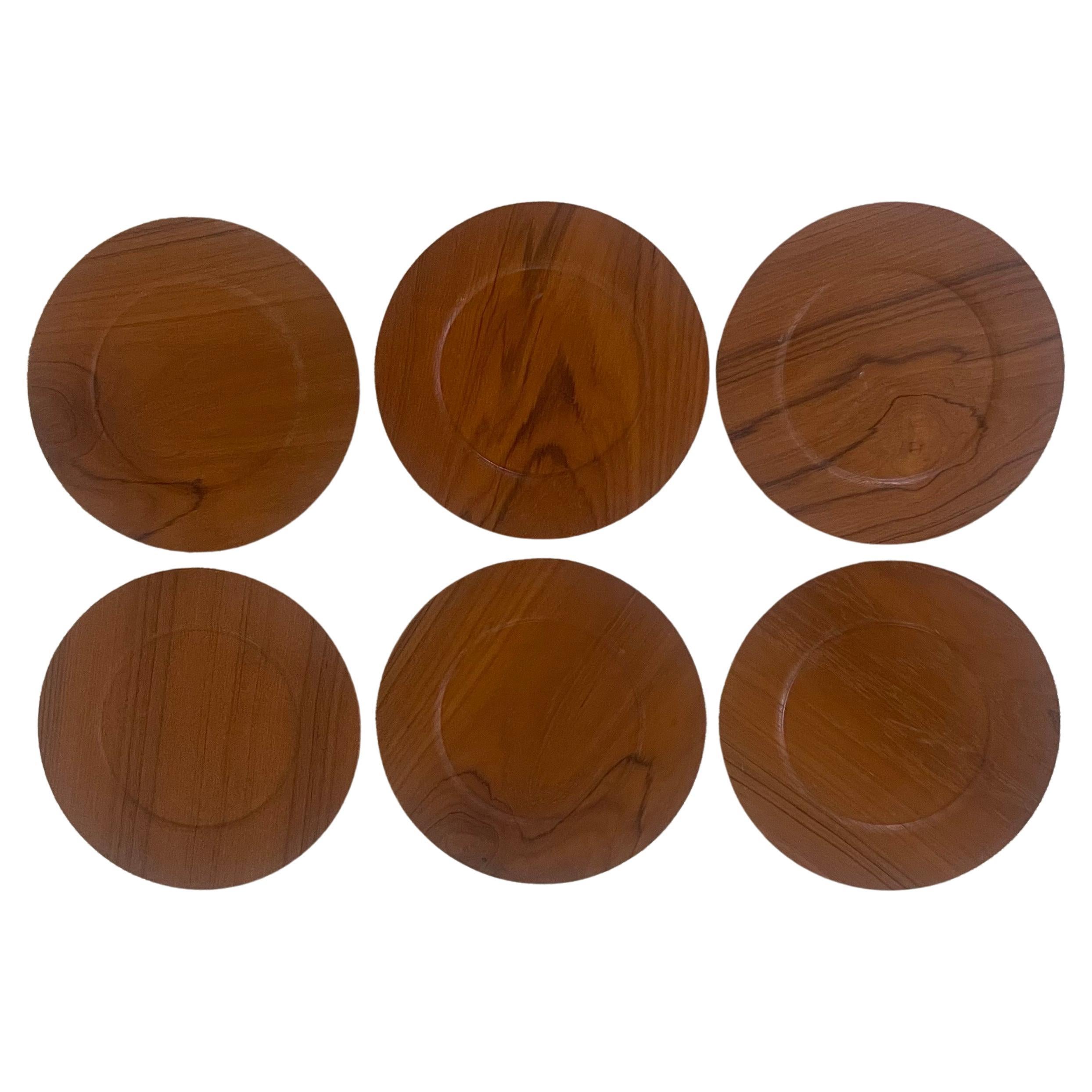 A nice set of six Danish Modern teak plates / chargers by Morsbak of Denmark, 1960s. The plates are in very good vintage condition and measure 11