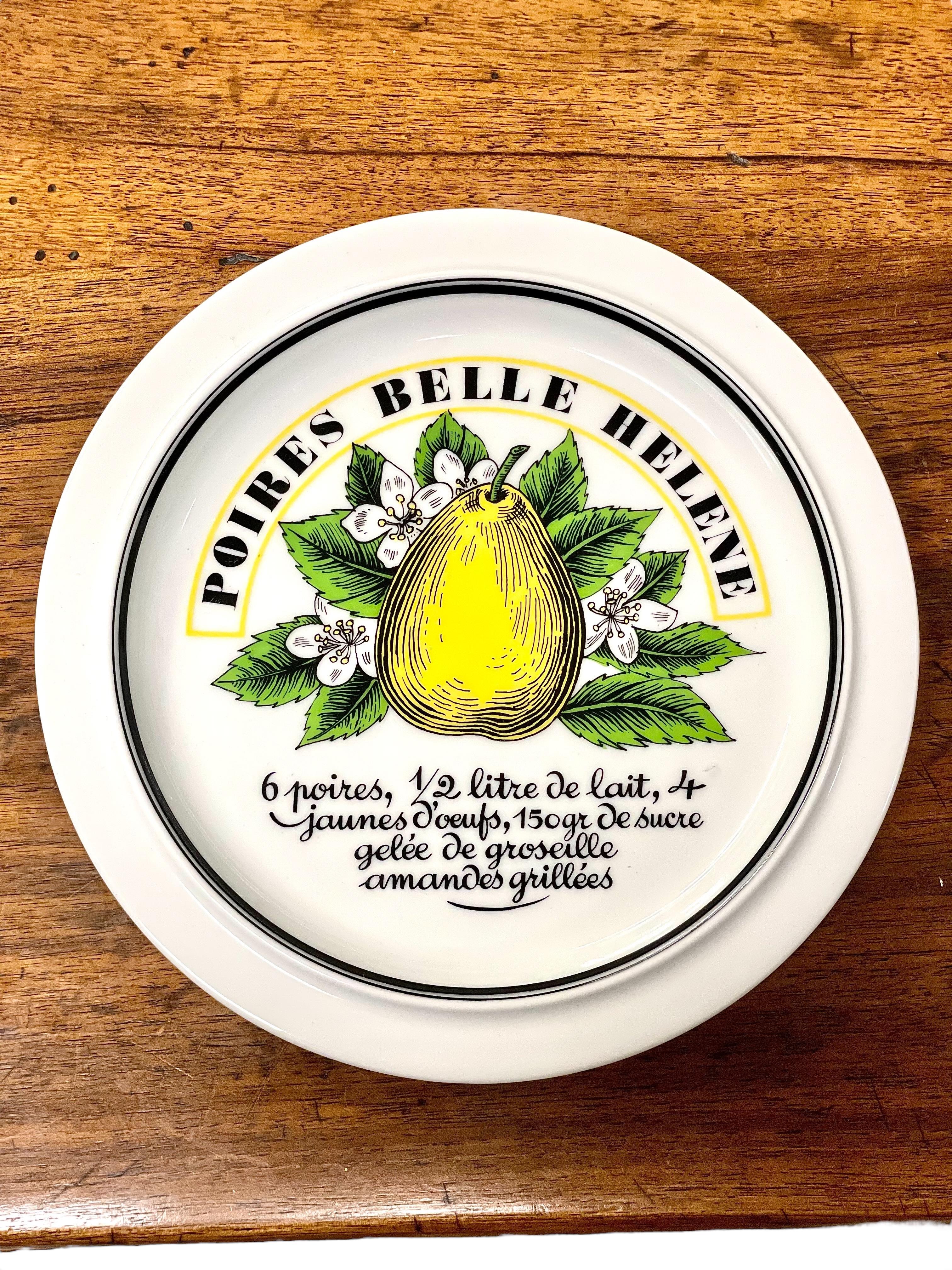 This exquisite set of six dessert plates by Porcelaine d’Auteuil, Paris, beautifully showcases the charm of vintage French craftsmanship. Each plate is made from fine porcelain and features a vibrant, hand-drawn illustration of a fruit-inspired