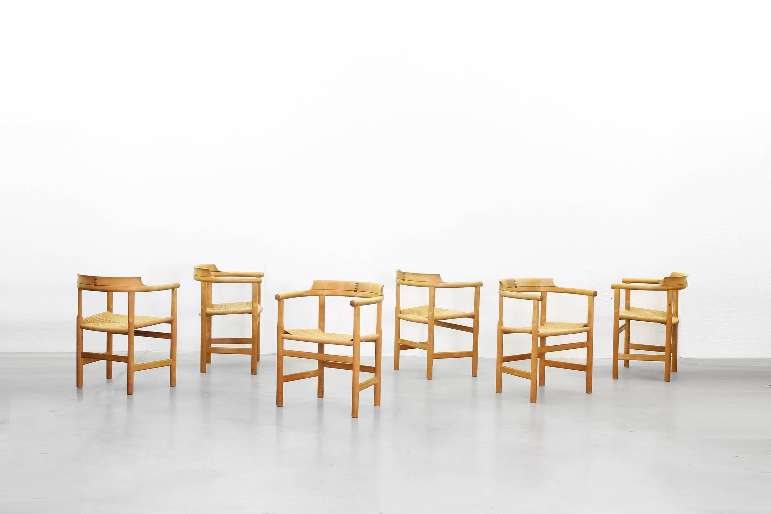 A beautiful set of six armchairs designed by Hans J. Wegner for PP Mobler, Denmark in 1975. All chairs are in a good condition without any repairs or damages. The frames are made of maple and the seats are woven with paper cord.