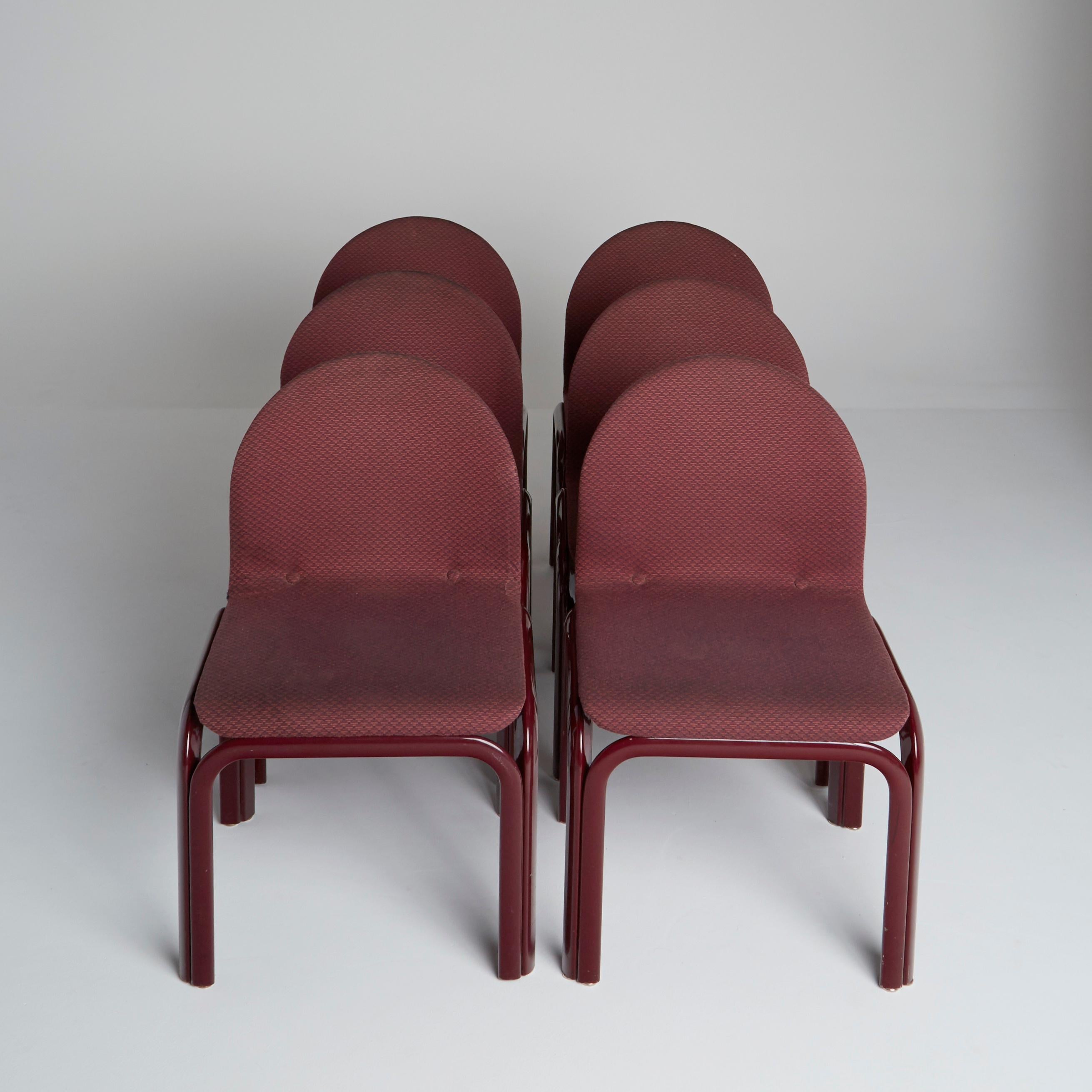 Set of Six (6) Model #54A chairs by Gae Aulenti for Knoll International with burgundy lacquered steel frames and sinuous bent plywood seats with its original fabric upholstery, original Knoll International labels/tags located underneath.

The frames