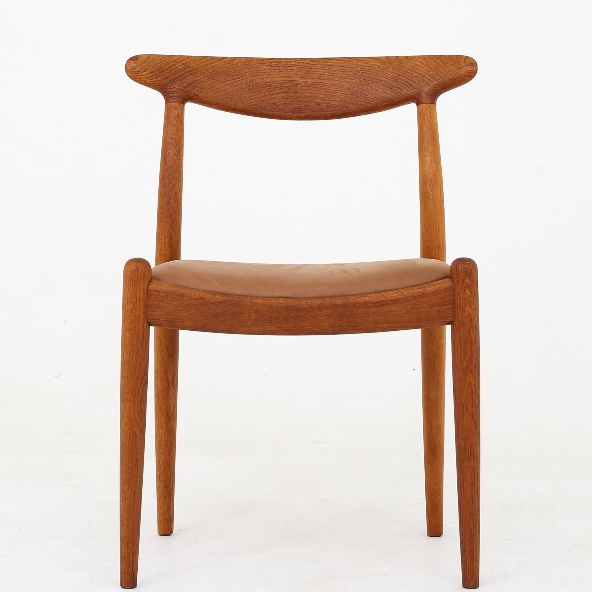 W1 - Set of six dining chairs in oak and reupholstered with Dunes Camel leather. Hans J. Wegner / C. M. Madsen.