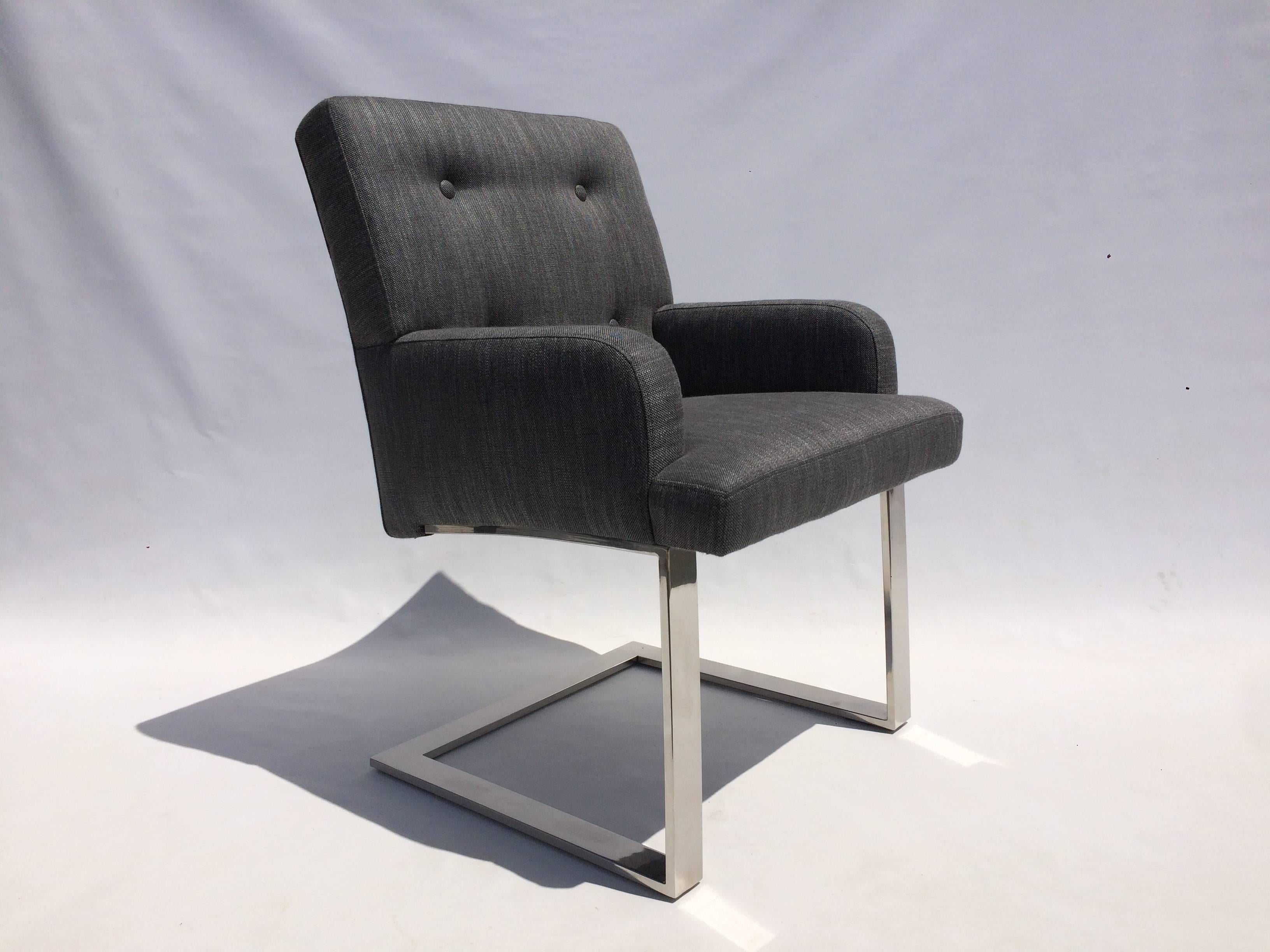 Set of six dining chairs, two armchairs and four side chairs from Paul Evans for Directional. Stainless steel and new charcoal-gray wool upholstery. Measures: Side chairs are 19