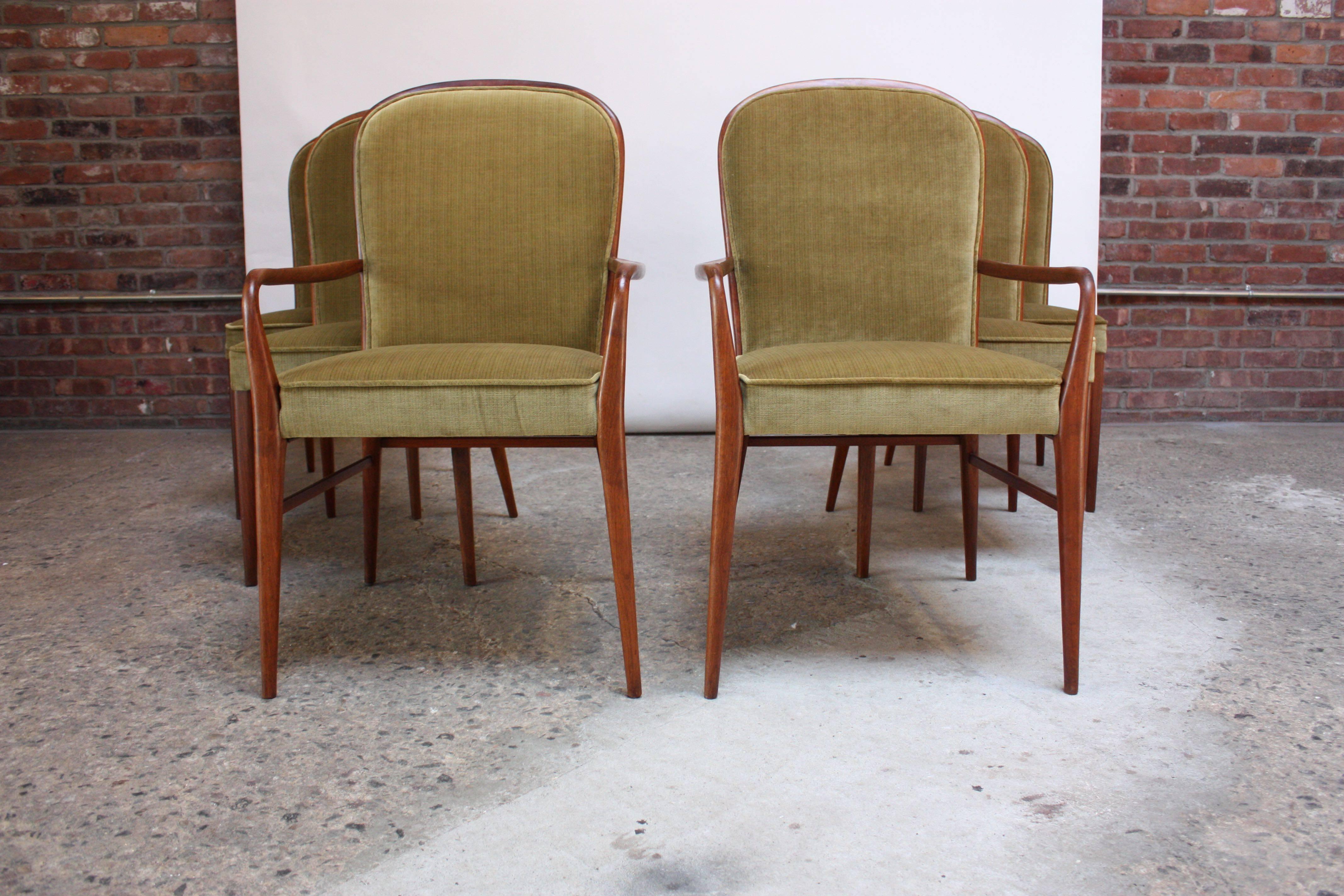 Rare set of Paul McCobb for H Sacks & Sons dining chairs (two captains and four side) composed of hand-carved walnut frames with sage velvet upholstery (front and back) in place of the original caned back. Set boasts dramatic lines with the sculpted