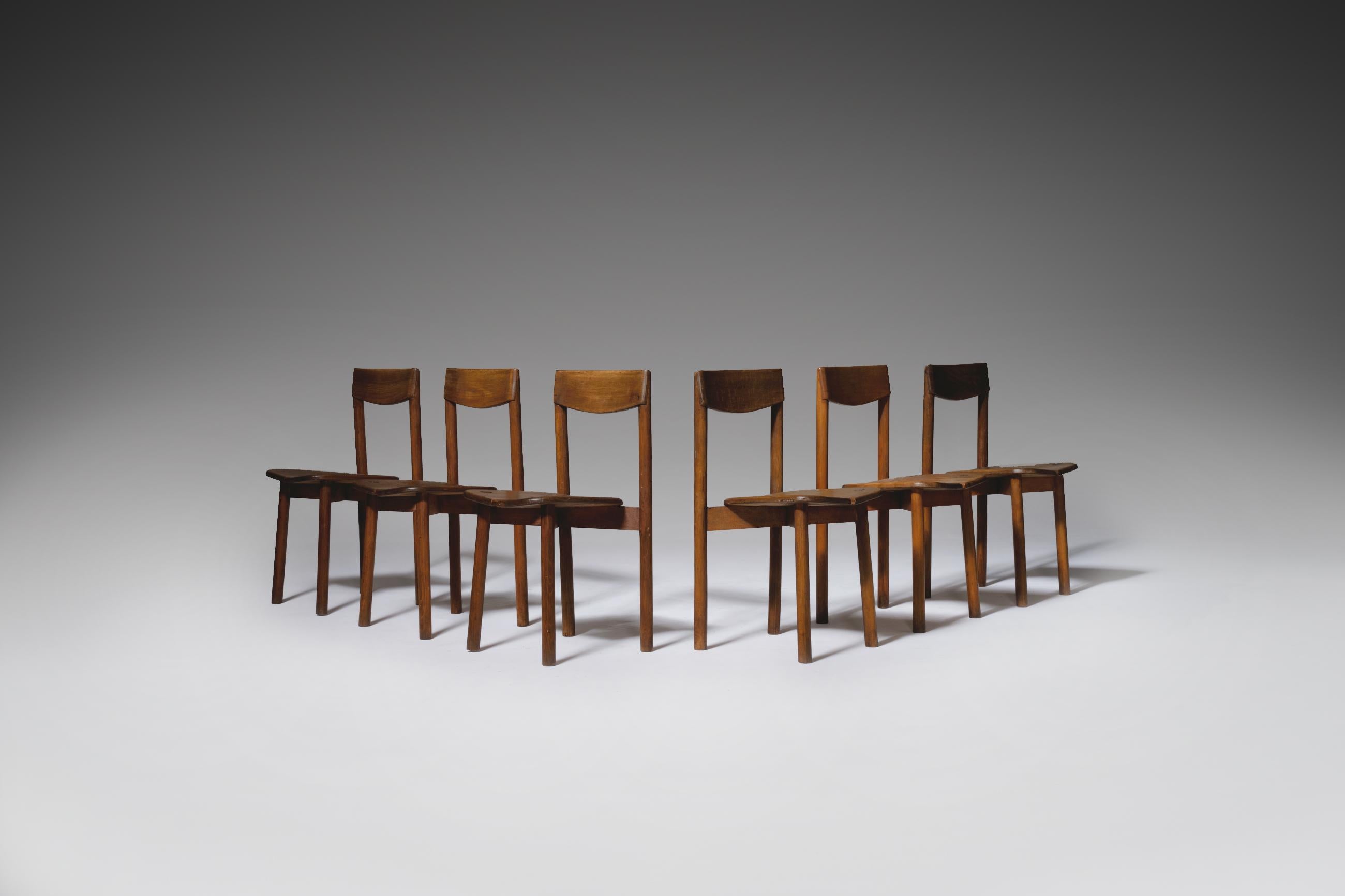 Set of 6 dining chairs by Pierre Gautier-Delaye, France, 1960s. Simple but elegant shapes executed in stained beechwood. The design shows typical French characteristics like the designs of Pierre Gautiers well-known colleagues Pierre Chapo and