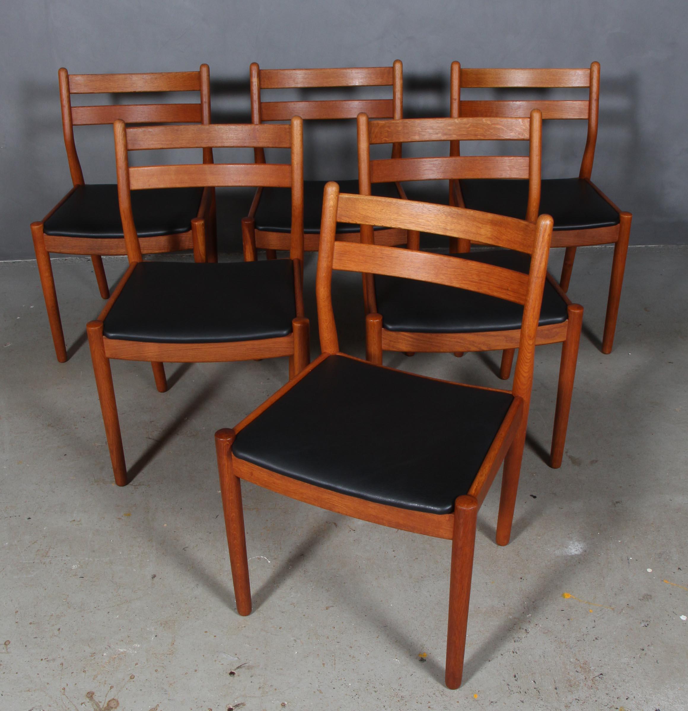 Set of six dining chairs by Poul Volther with frame of oak.

New upholstered cushions with black aniline leather.

Made by FDB, model J61.