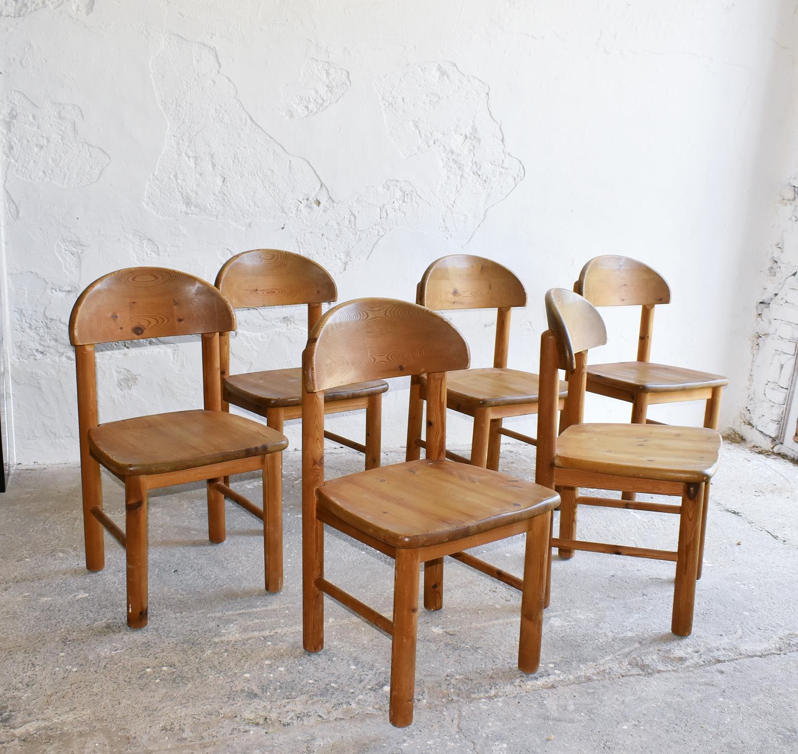 These charming and organic solid pine dining chairs were designed by Danish architect Rainer Daumiller and produced in the 1970s by Hirtshals Sawmill (also known as Hirtshals Savværk). With a beautifully rounded seat and curved backrest, the design