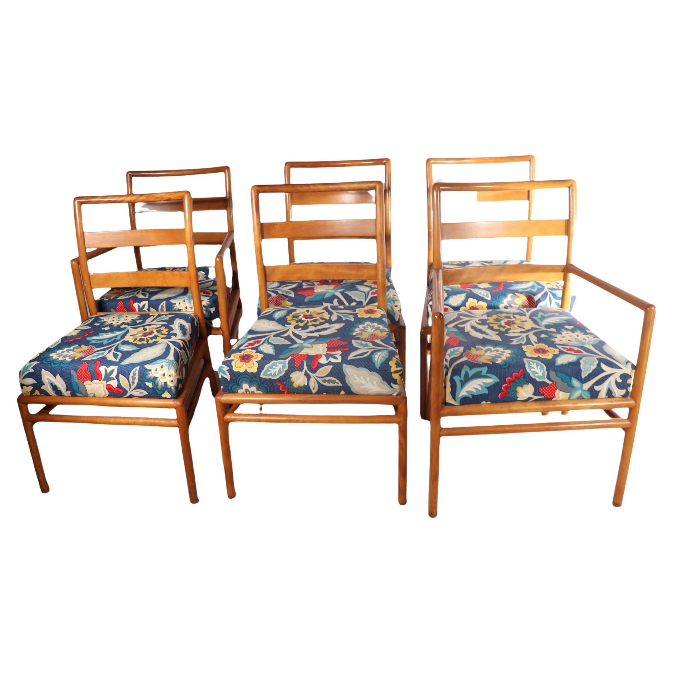 Exceptional set of 6 dining chairs by noted mid century designer, Robsjohn Gibbings, for Widdicomb Furniture. The set includes 2 arm, and 4 armless chairs, it is in very good condition, showing only light cosmetic ear, normal and consistent with