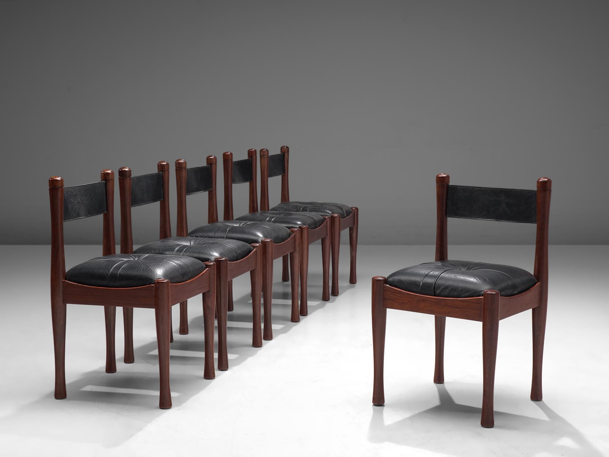 Silvio Coppola for Bernini, set of 6 dining chairs, beech and black leather, Italy, 1960s

The chairs feature a sturdy darkened beech wood frame and black leather seats. The backrest is also made of leather. The seat is tufted and filled richly for