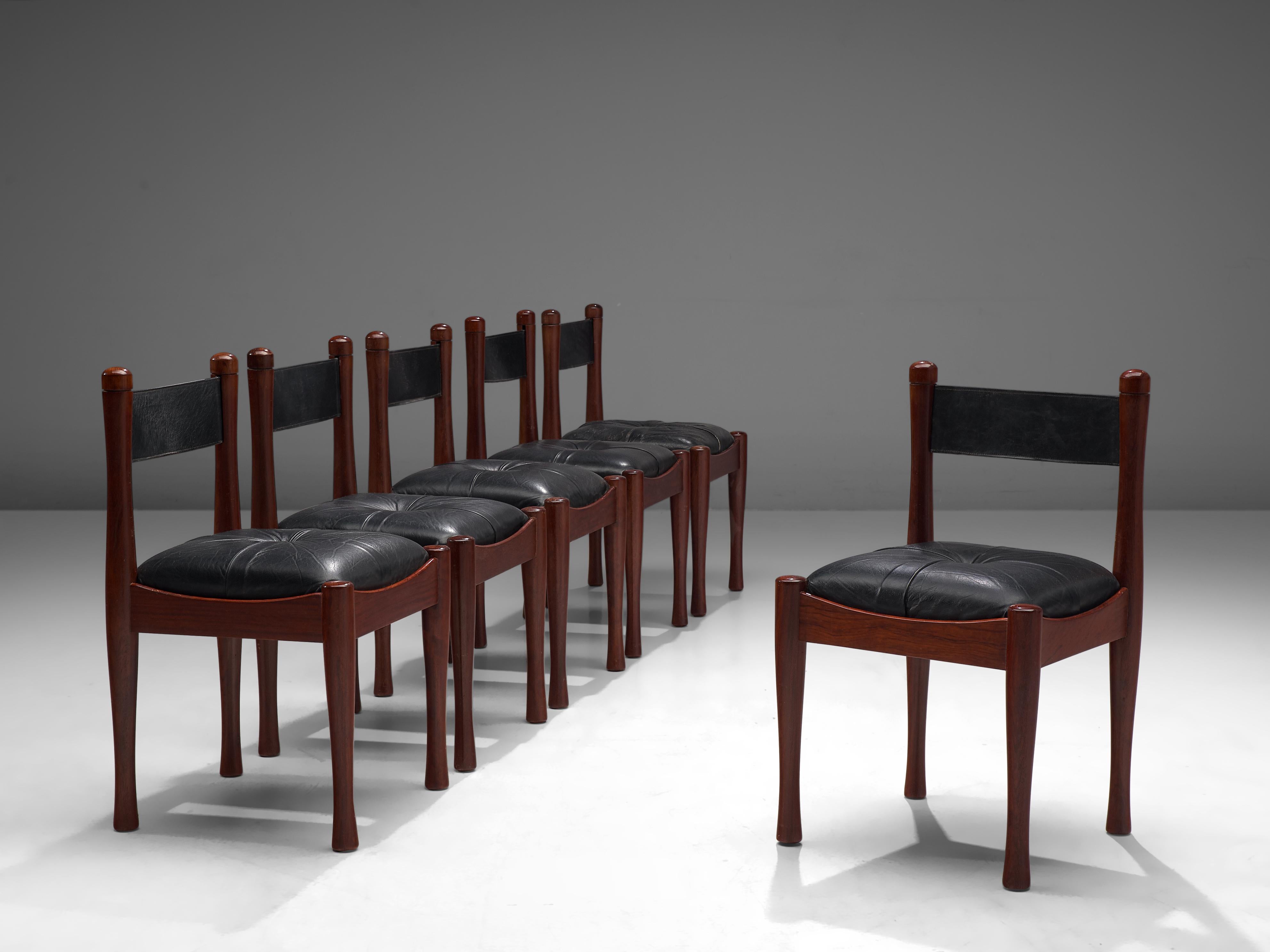 Silvio Coppola for Bernini, set of six dining chairs, stained wood, leather, Italy, 1960s

This set of chairs are designed by Silvio Coppola for Bernini in the 1960s. These chairs feature a characteristic darkened frame and upholstered black leather
