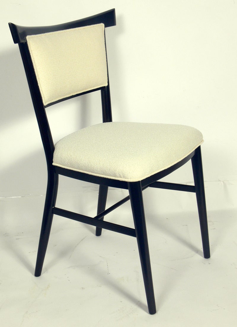 Set of six dining chairs, designed by Paul McCobb for Directional, circa 1950s. This set has been completely restored in an ultra-deep brown lacquer with ivory bouclé upholstery. The two armchairs measure 35.5
