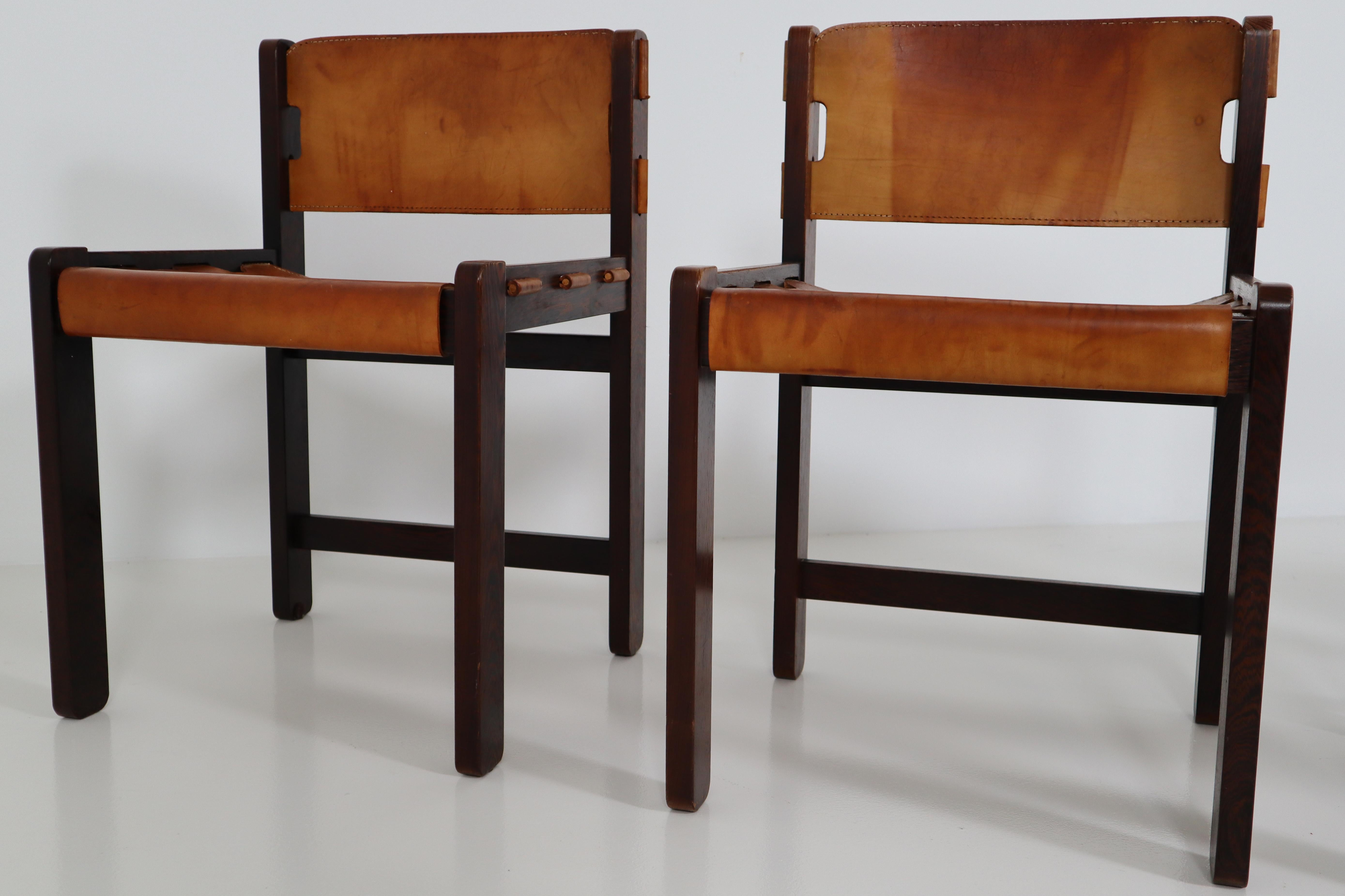Set of six dining chairs in absolutely gorgeous thick cognac saddle leather, circa 1970s. This set was acquired from the original owners. Chairs are in vintage condition with incredible patina and natural wear to the leather - adds tons of character.