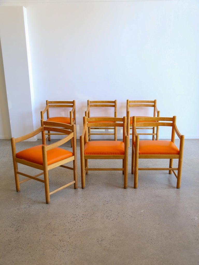 Unique set of six Mid Century Modern Italian dining-armchairs in rosewood and leather.

Place of Origin: Italy
Date of Manufacture: 1960s
In style: Mid Century Modern
Materials & Techniques: Rosewood $ Leather 
Condition: Good condition, wear