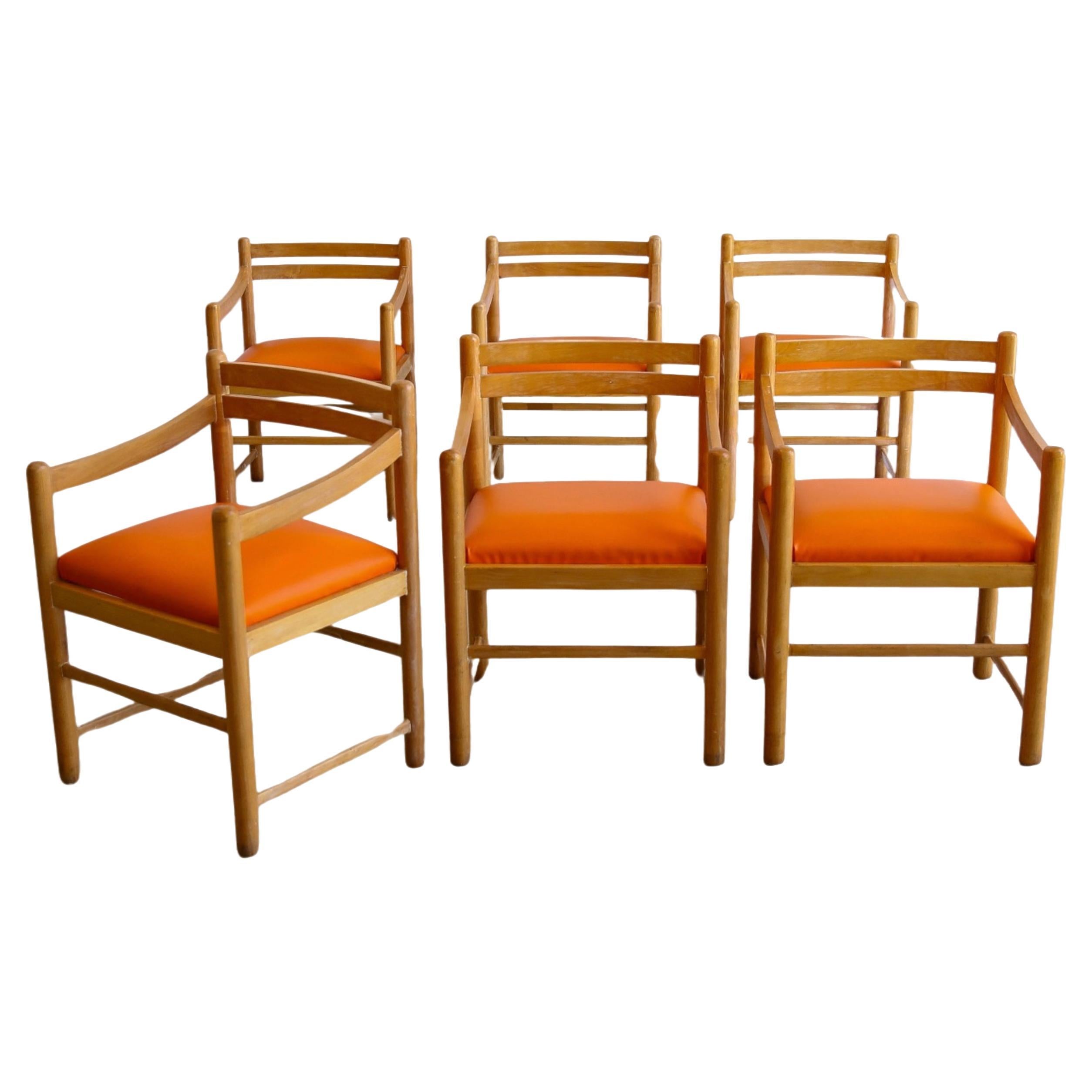 Ensemble de six chaises de salle à manger en bois de rose et coussins en cuir orange en vente