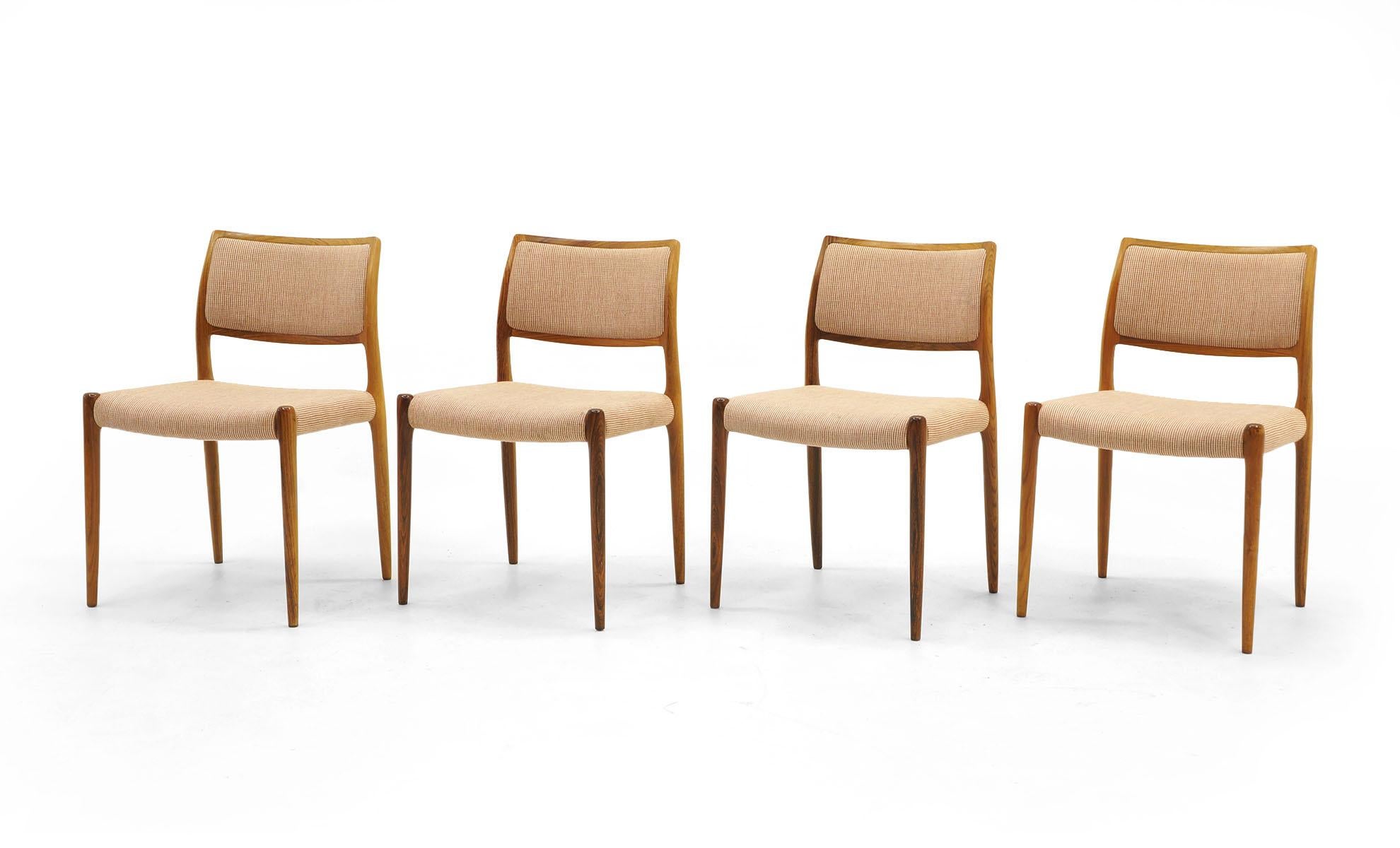 Set of six Danish modern Moller dining chairs in Brazilian rosewood. Two armchairs and four side chairs in excellent condition.

Side chair dimensions:
Measures: 30.5 in. H x 19 in. W x 10.5 in. D
Seat height 17.75 in.
Armchair dimensions