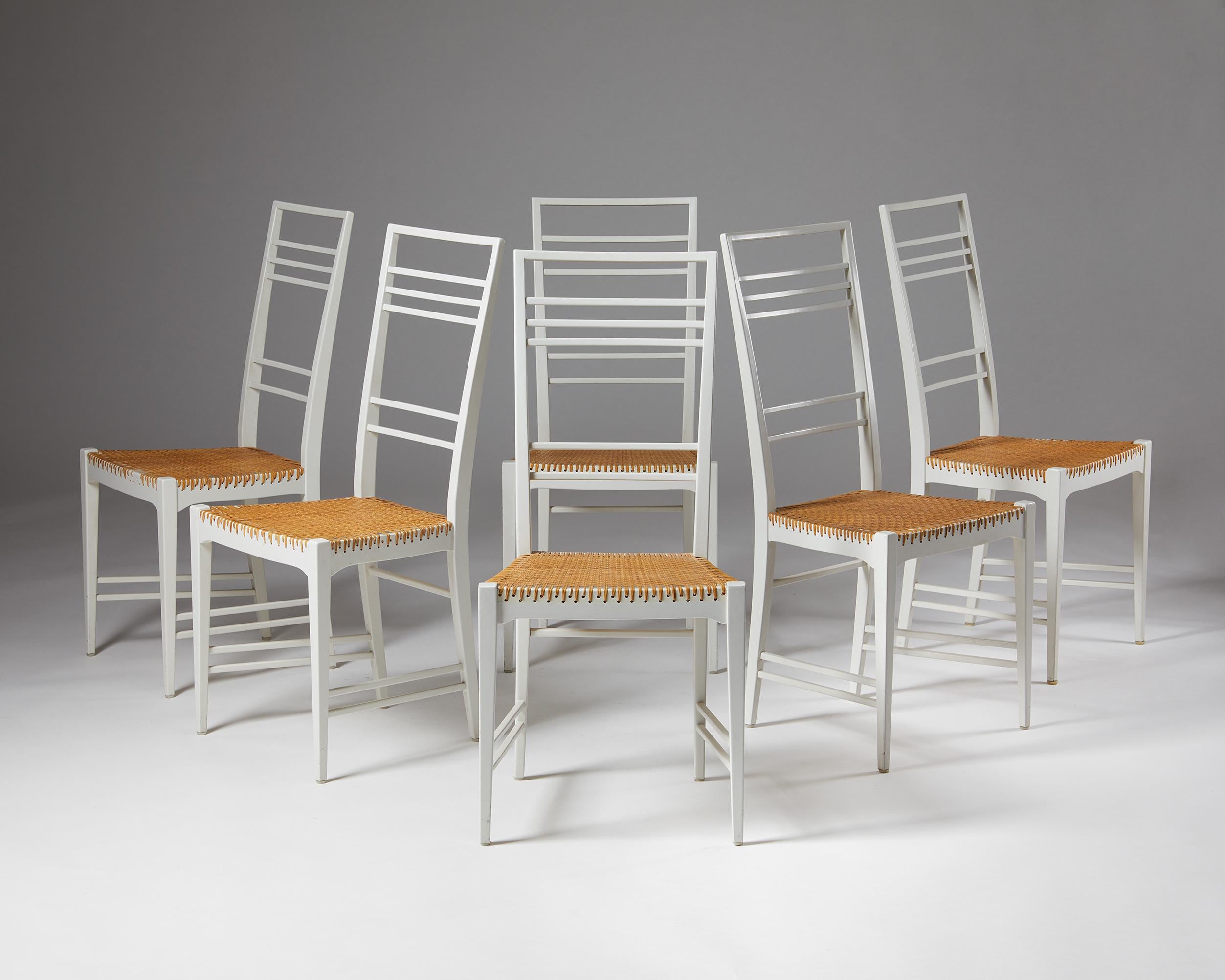 Set of six dining chairs “Poem” designed by Erik Chambert,
Sweden. 1953.
Lacquered birch and cane.

This extraordinarily light and delicate high-backed chair design called “the Poem Chair” is comfortable and very strong. Interestingly, the cane