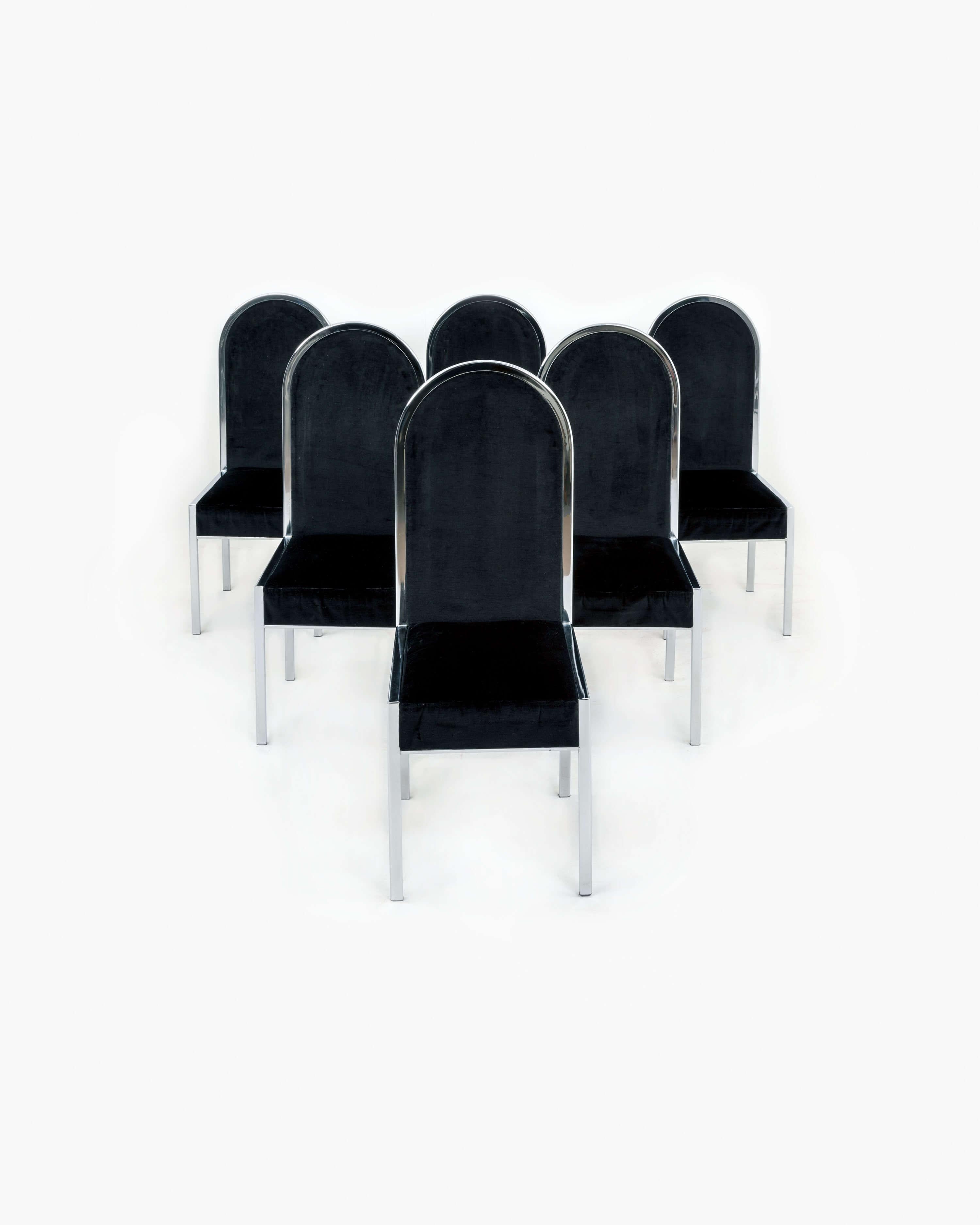 Introduce a timeless charm to your dining space with this remarkable set of six dining chairs. Crafted in the 1970s in Italy, each chair showcases a solid chrome frame, exuding durability and sleekness. The captivating black velvet upholstery adds a