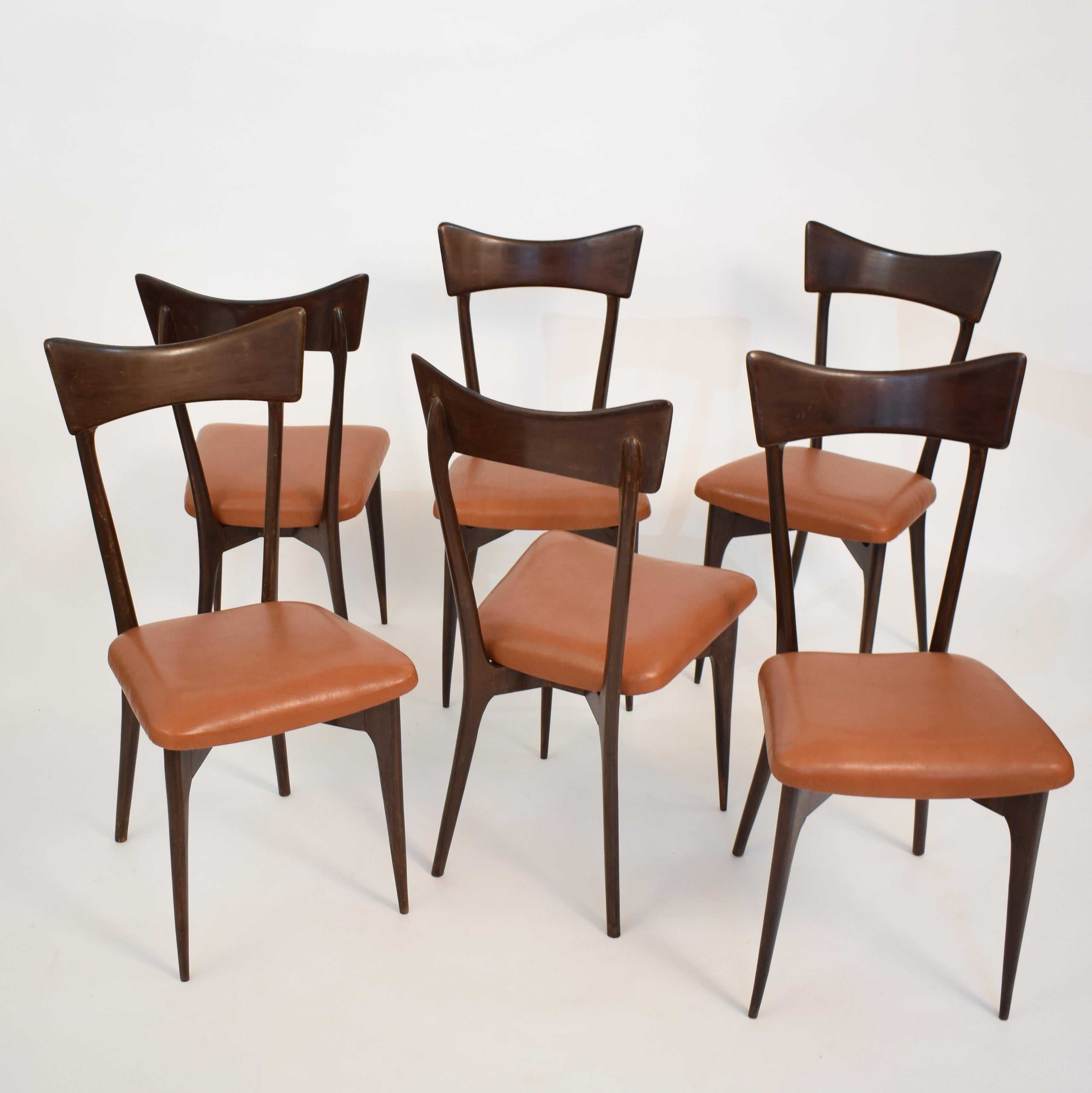 This set of six chairs was designed by Ico Parisi in 1945. It was produced by Colombo Cantu in Italy. 
The chairs are in very good condition and have a great Patina. The seat covers are redone in a cognac leather.