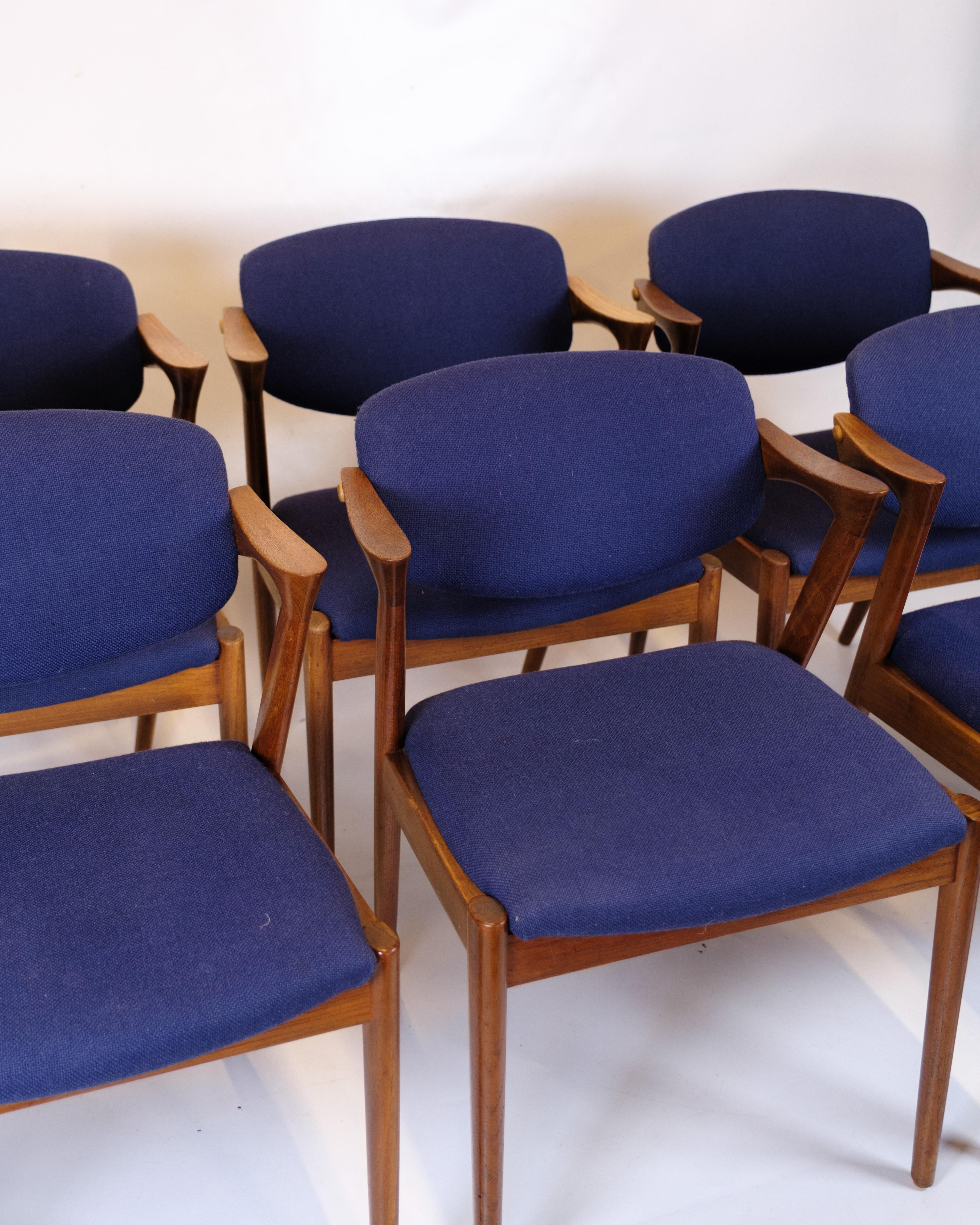 Set of six dining chairs, model 42, designed by Kai Kristiansen and produced by Schou Andersen in the 1960s. The chairs are made of teak with the characteristic elegant and organic design language that characterizes Kristiansen's design. The seats