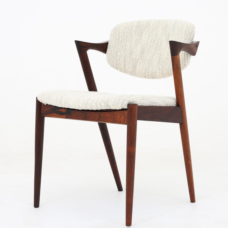 Model 42 - set of six armchairs in rosewood, reupholstered with new textile (atlas natural from Dedar). Maker Schou Andersen Møbelfabrik.