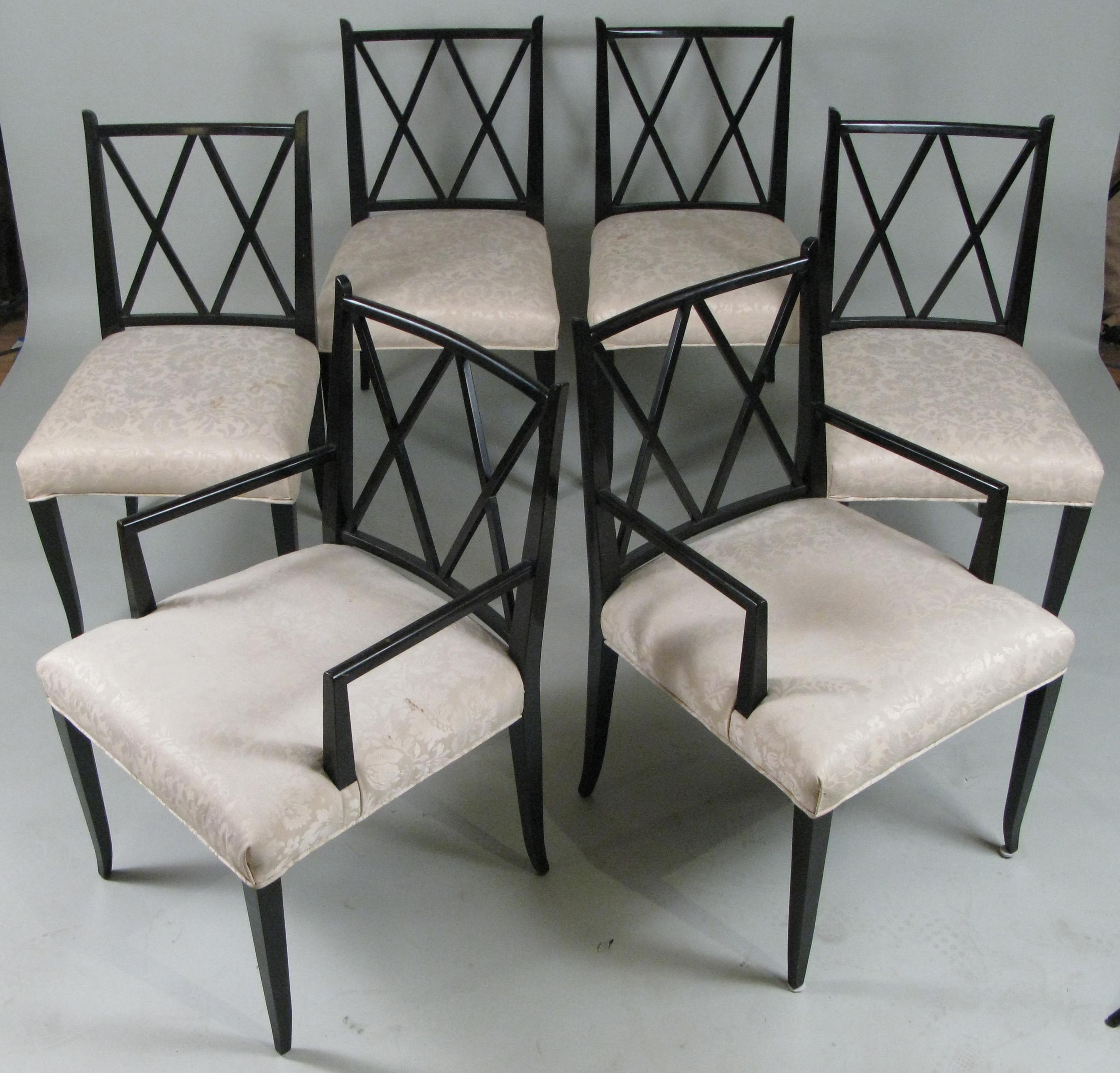 An elegant and Classic set of six ebonized mahogany dining chairs designed by Tommi Parzinger for Parzinger originals, circa 1950. Beautiful and graceful design with a double X in the back, and wide and comfortable seats. The set is comprised of a
