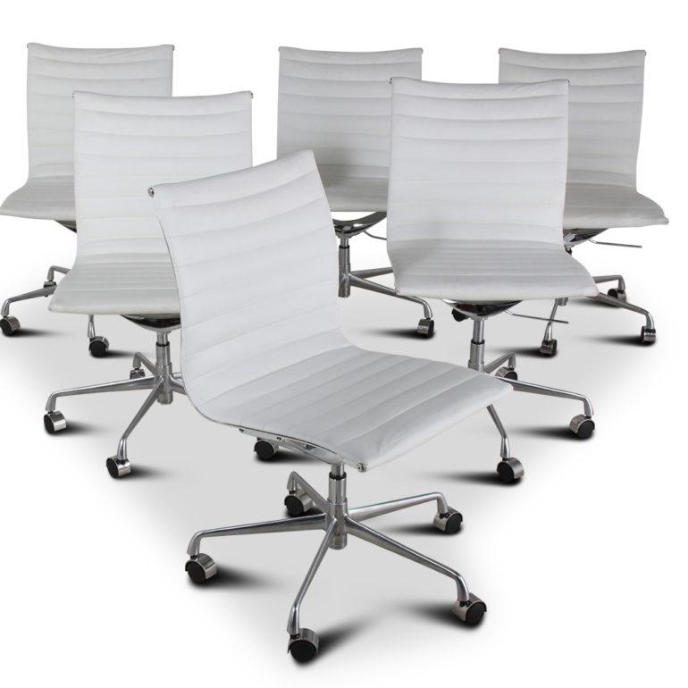 A set of six Eames EA-105-style aluminum-framed chairs with white leather upholstery, circa 1970.

Charles Ormond Eames, Jr. and Bernice Alexandra “Ray” Kaiser Eames were an American married team of commercial and industrial designers who made