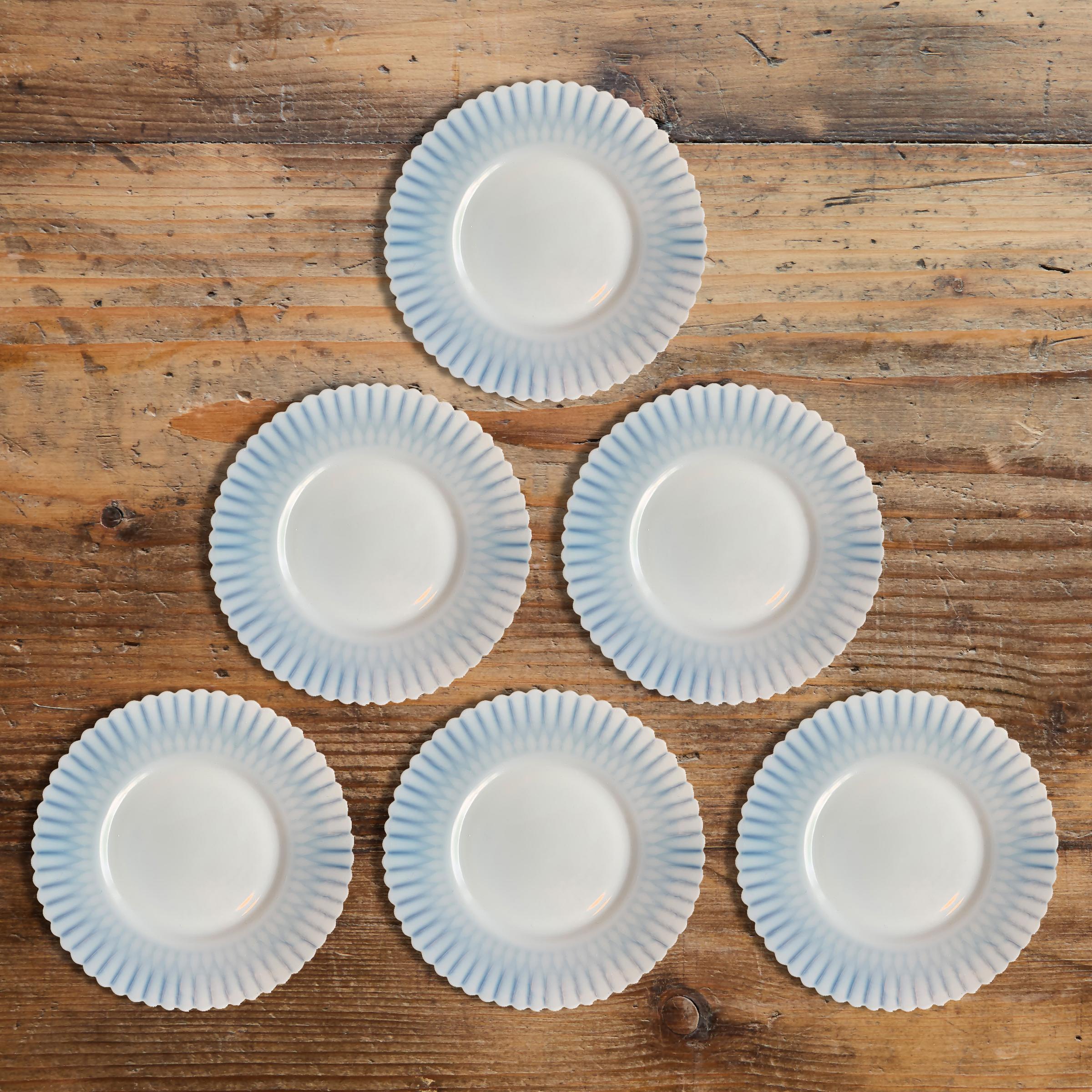 A wonderful sweet of six early 20th century American translucent opaline glass dessert plates with scalloped edges.