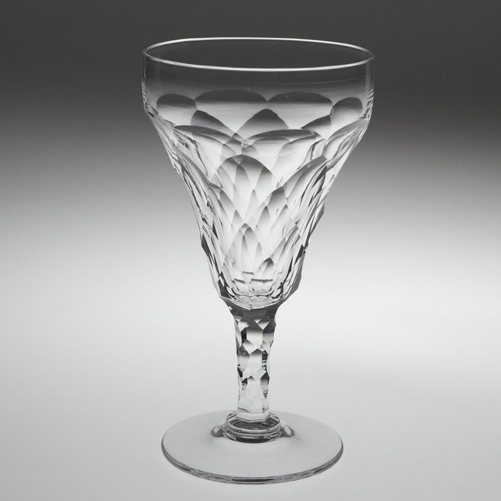 Heading : Set of six early 20th century facet cut red wine or water goblets
Period : Early 20th century c1930
Origin : England 
Colour : Clear and bright 
Bowl : Diamond facet and scale cut
Stem : Elongated hexagonal facet
Foot : Conical 
Pontil :