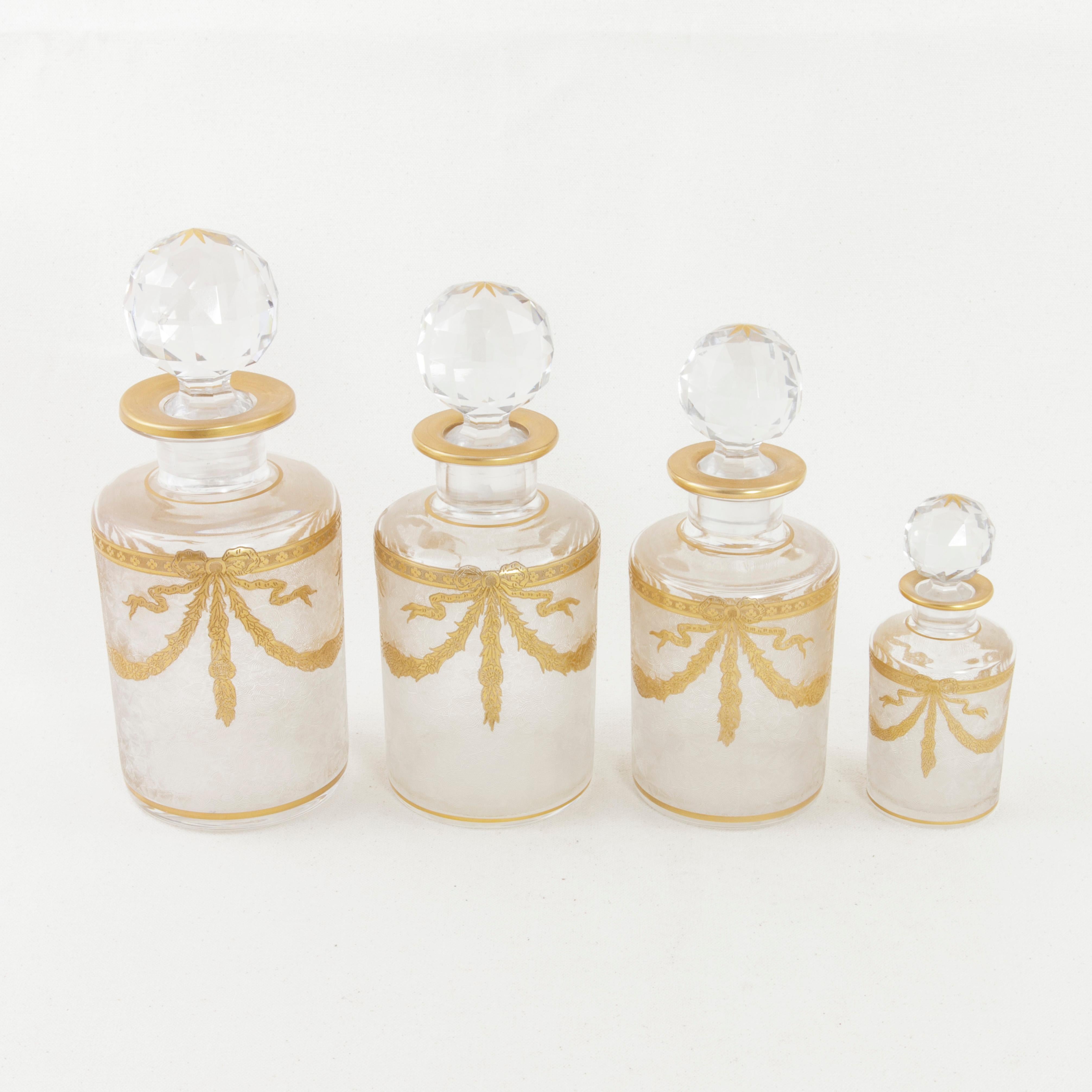 Set of Six Early 20th Century French Baccarat Crystal and Gold Vanity Bottles (Louis XVI.)