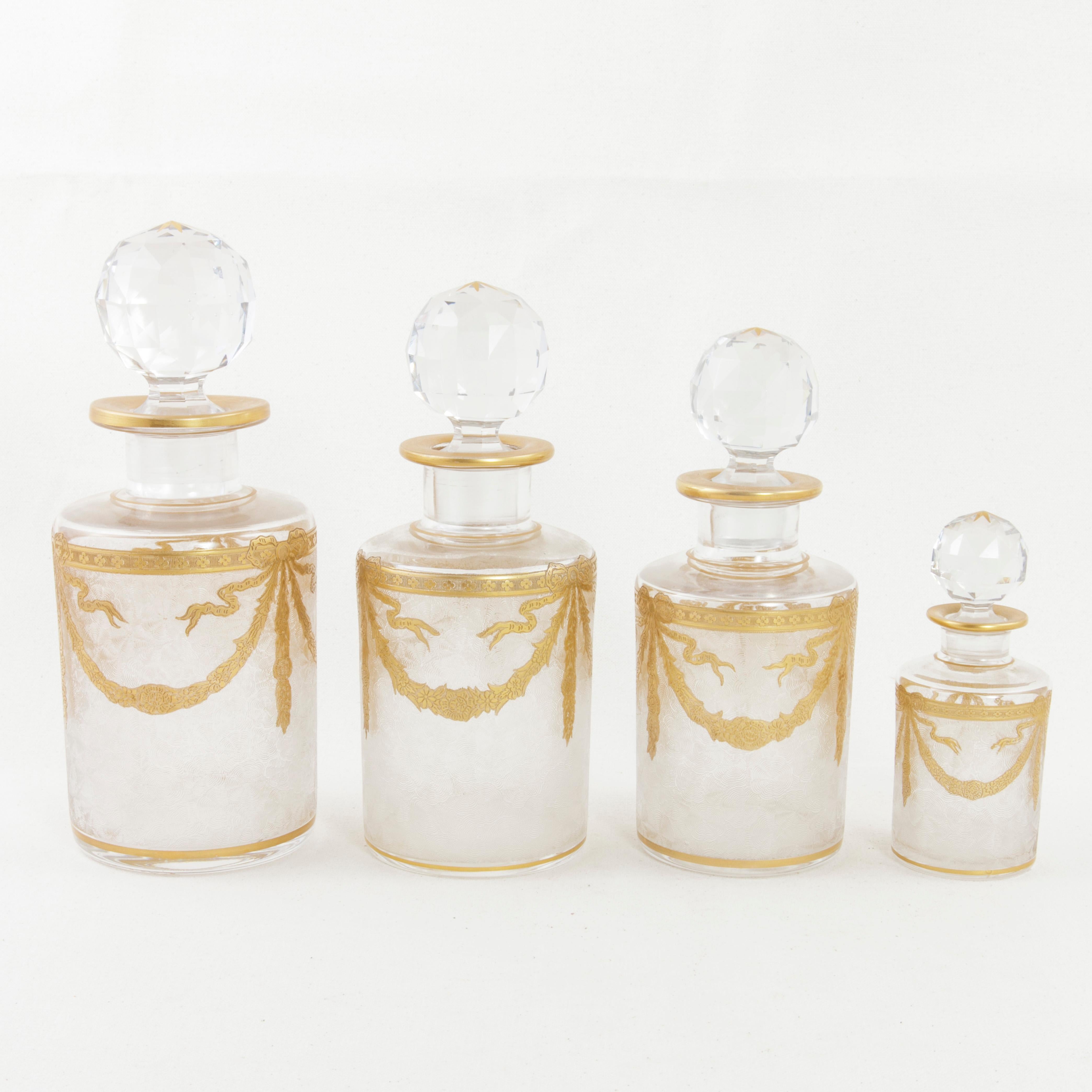 Set of Six Early 20th Century French Baccarat Crystal and Gold Vanity Bottles 1