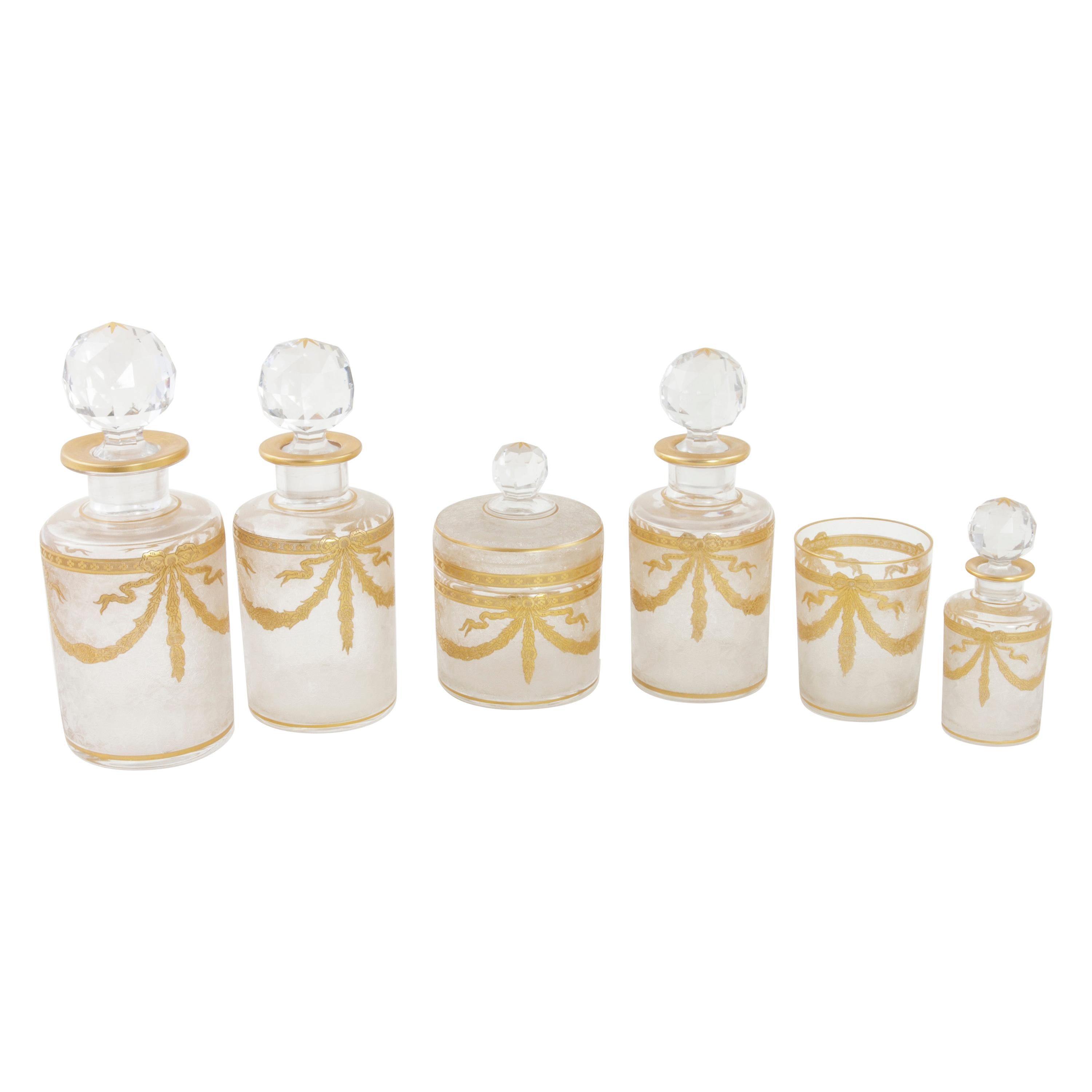 Set of Six Early 20th Century French Baccarat Crystal and Gold Vanity Bottles