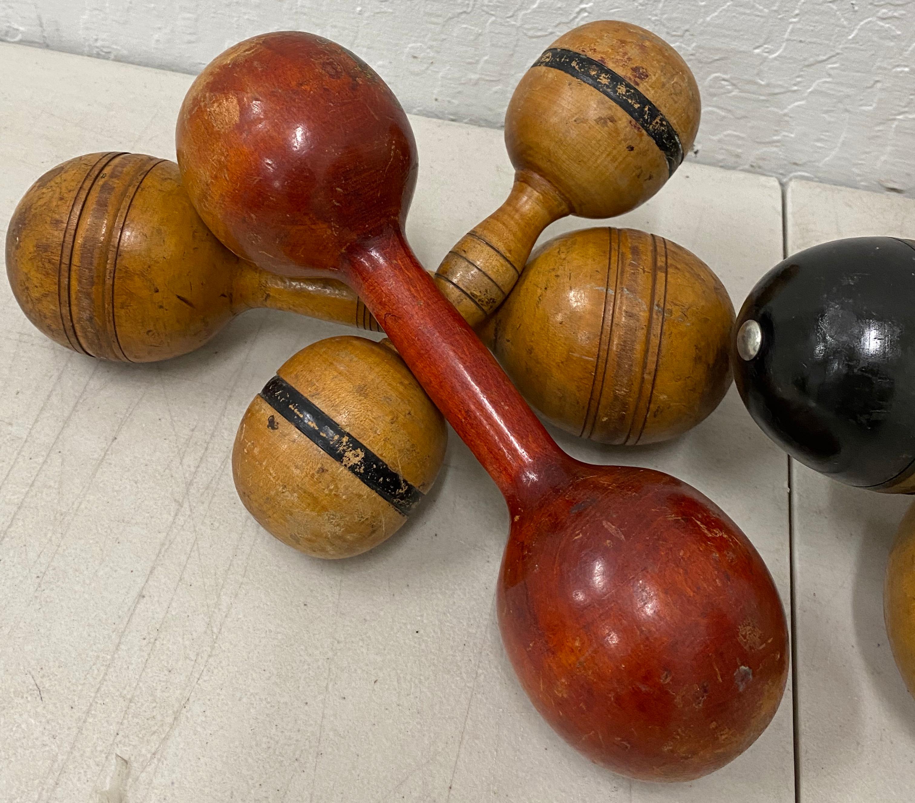 Set of six early 20th century wooden dumbbell exercise gym hand weight, circa 1930

Each dumbbell is weighted and ready to use for exercise or display

The longest dumbbell measures 10