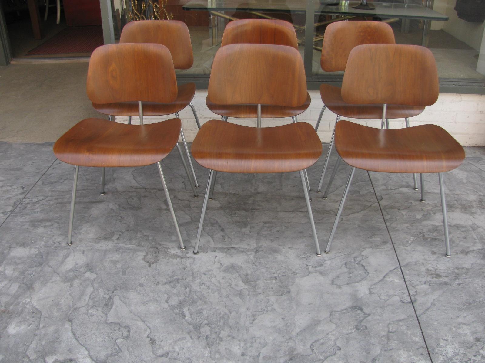 Wonderful set of six DCM dining chairs by Charles and Ray Eames. This is an early set as they are all labeled Evans molded plywood along with The Herman Miller Furniture Co. believed to be 1946 edition. Chairs are all in very good vintage condition
