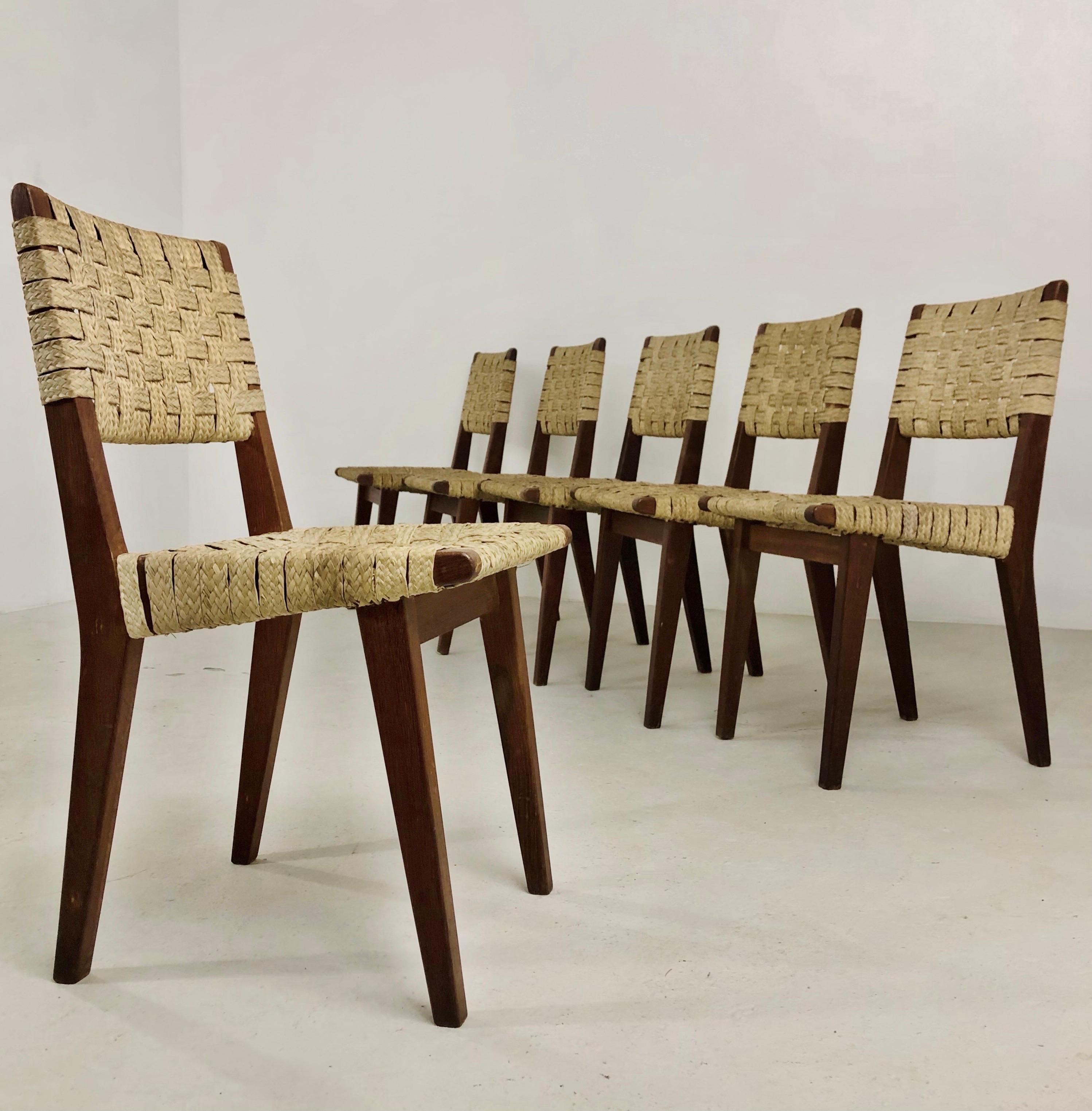Set of six chairs designed by Jens Risom. The oldest model features a solid oak structure and natural reed weaving for both the backrest and seat. The chairs have developed a beautiful patina over time, adding to their aesthetic appeal. Jens Risom