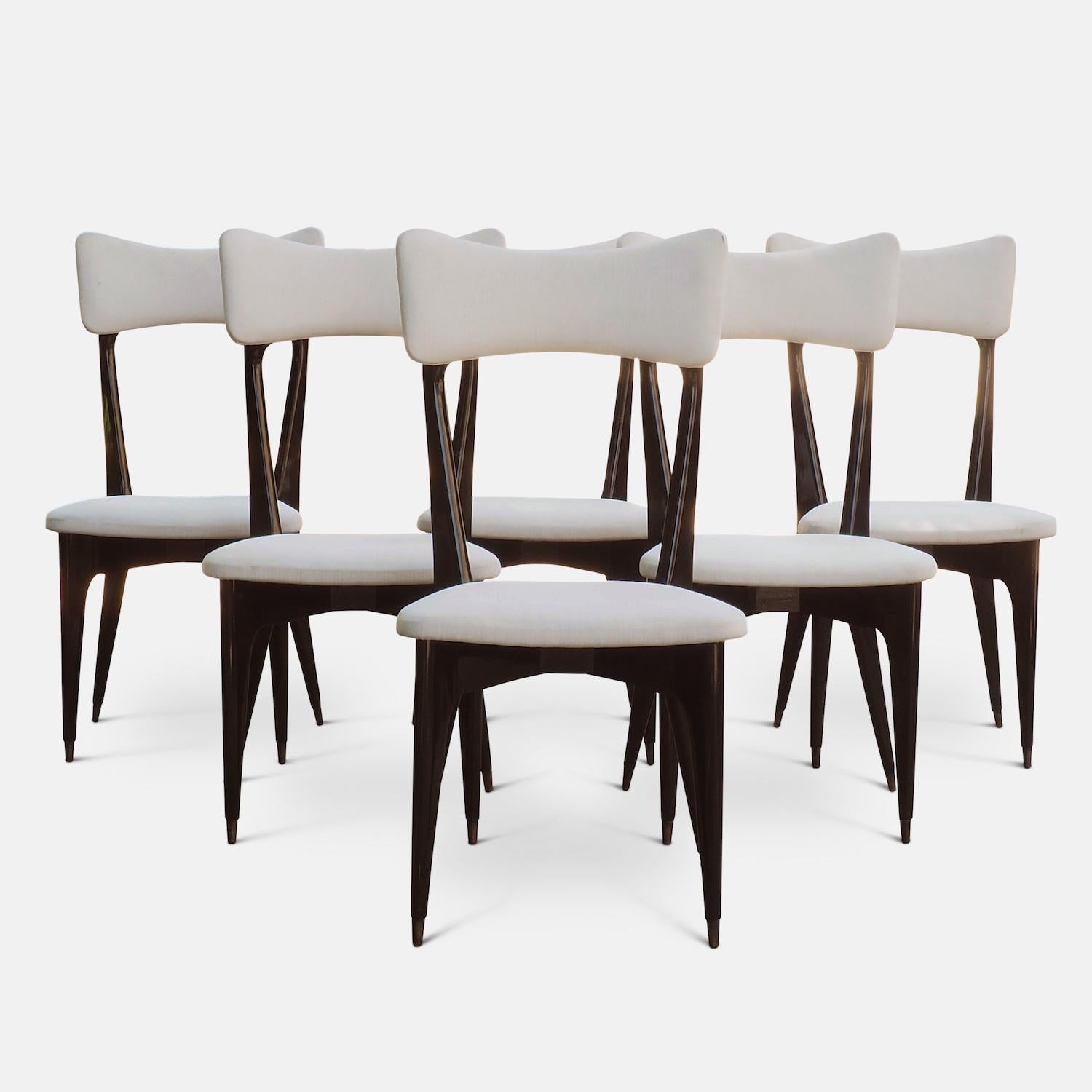 Six ebonized dining chairs attributed to Ico Parisi, of modernist design with characteristic cruciform leg configuration, sculpted wood and bass fittings.

Literature: A similar example p. 196 Ico Paris Catalogue Raisonne 1936-1960 Roberta Lietti