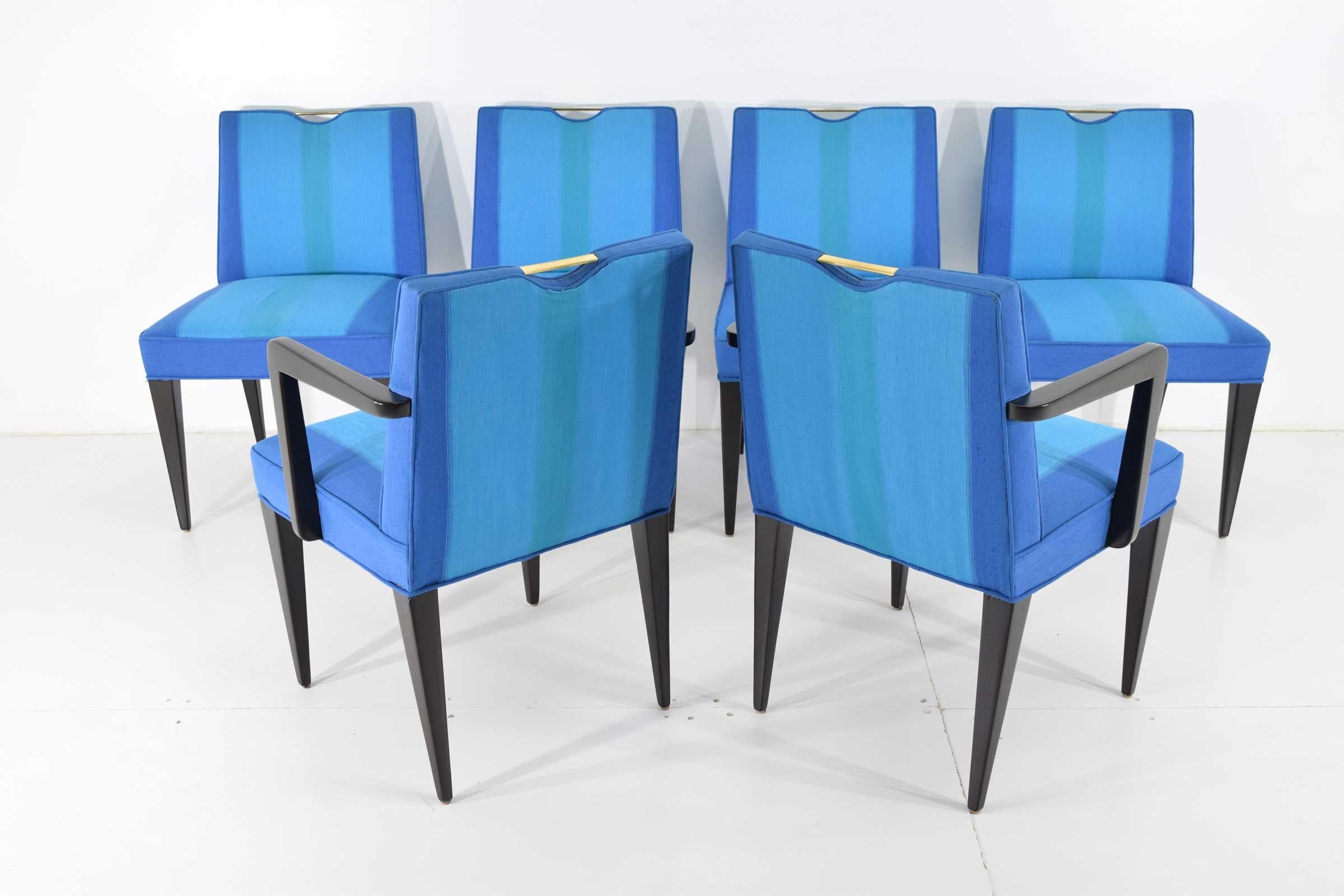 Models 4592 (armless) and Model 4593 (armed version) dining chairs. designed by Edward J Wormley for Dunbar Furniture Company. The chairs have a brass handle on the back, mahogany legs and bright upholstery. Not sure if upholstery is original but it