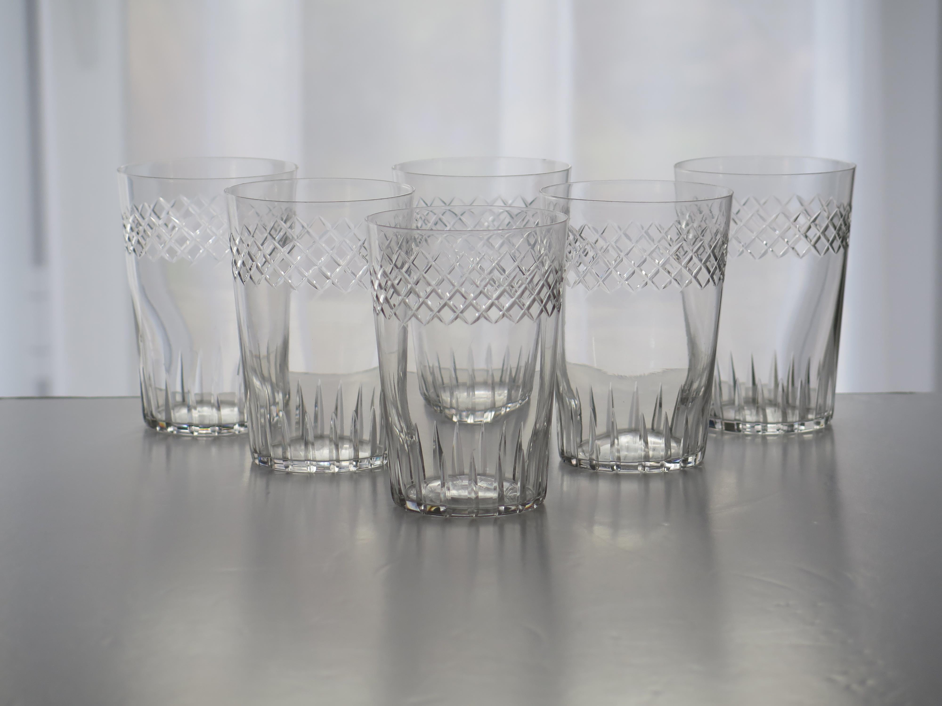 These are a good set of six crystal glass, engraved tumblers or drinking glasses, dating to the Edwardian period, circa 1905

Each glass tumbler has a circular slightly tapered shape, decorated with an engraved horizontal pattern to its upper half