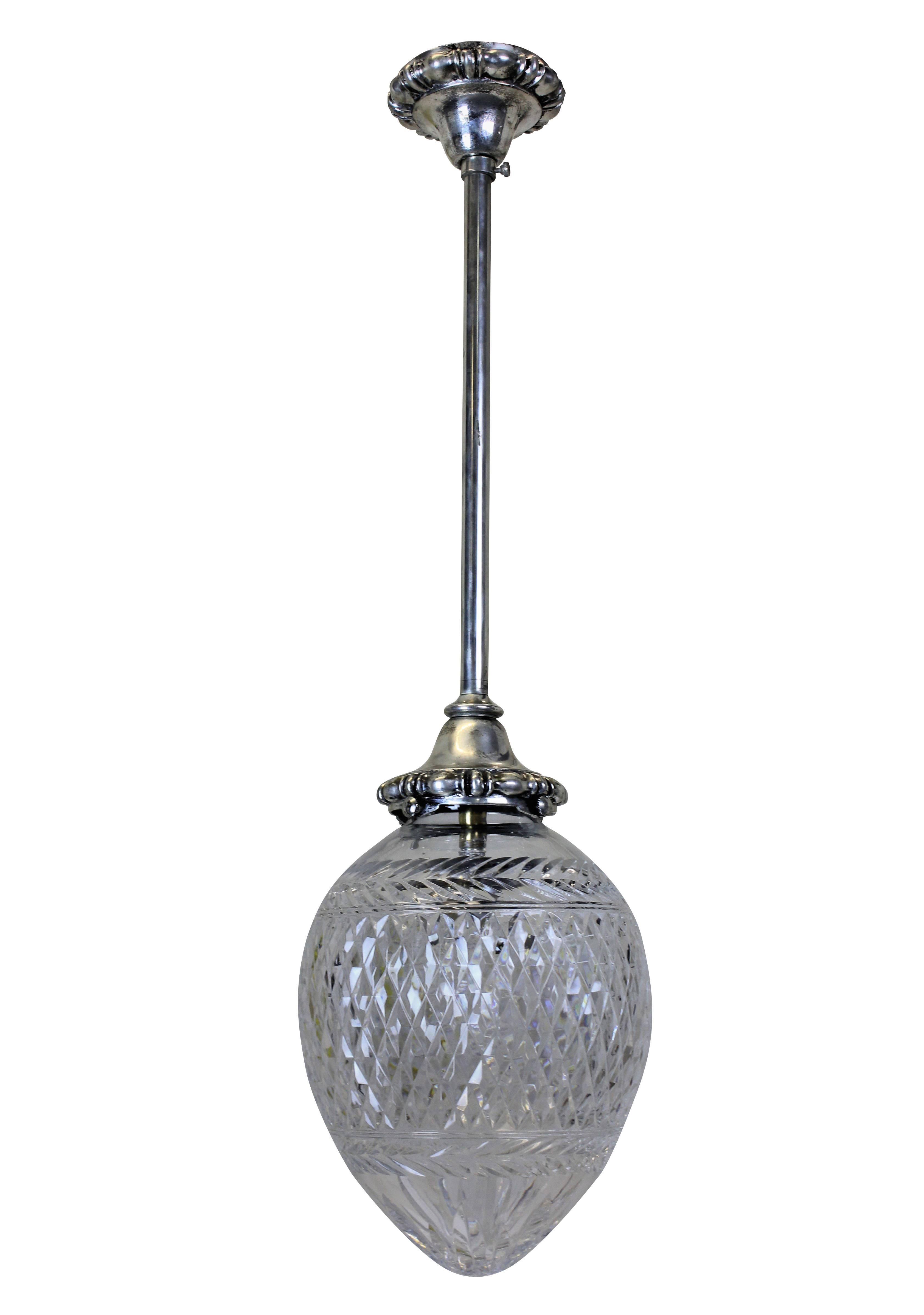 A set of six Edwardian hanging pendant lights in silver plated brass with cut-glass acorn shades.