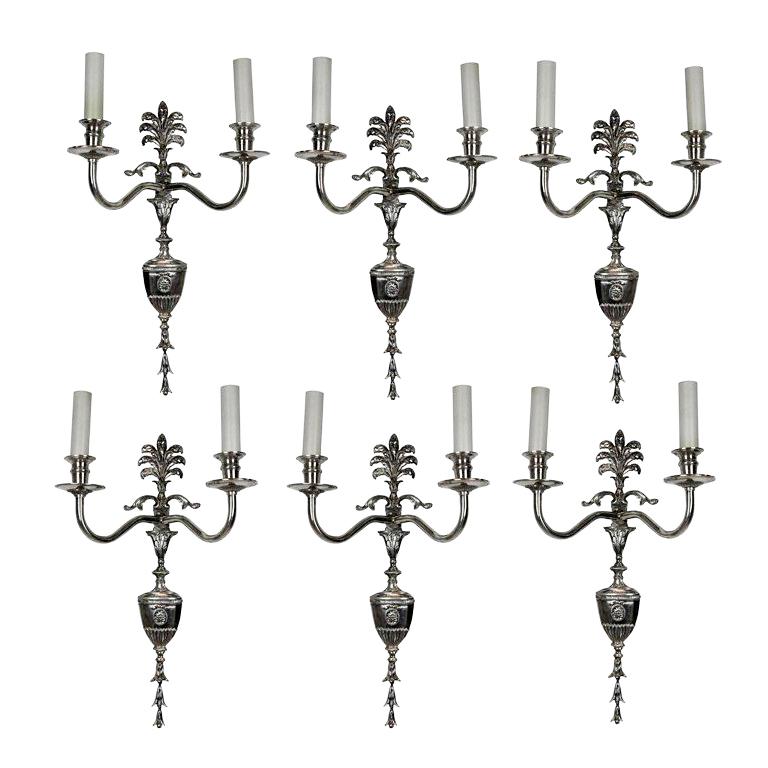 A set of six English Edwardian silver plated bracket twin branch wall sconces.
      