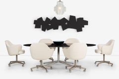 Set of Six Eero Saarinen Swivel Arm Dining Chairs on Wheels