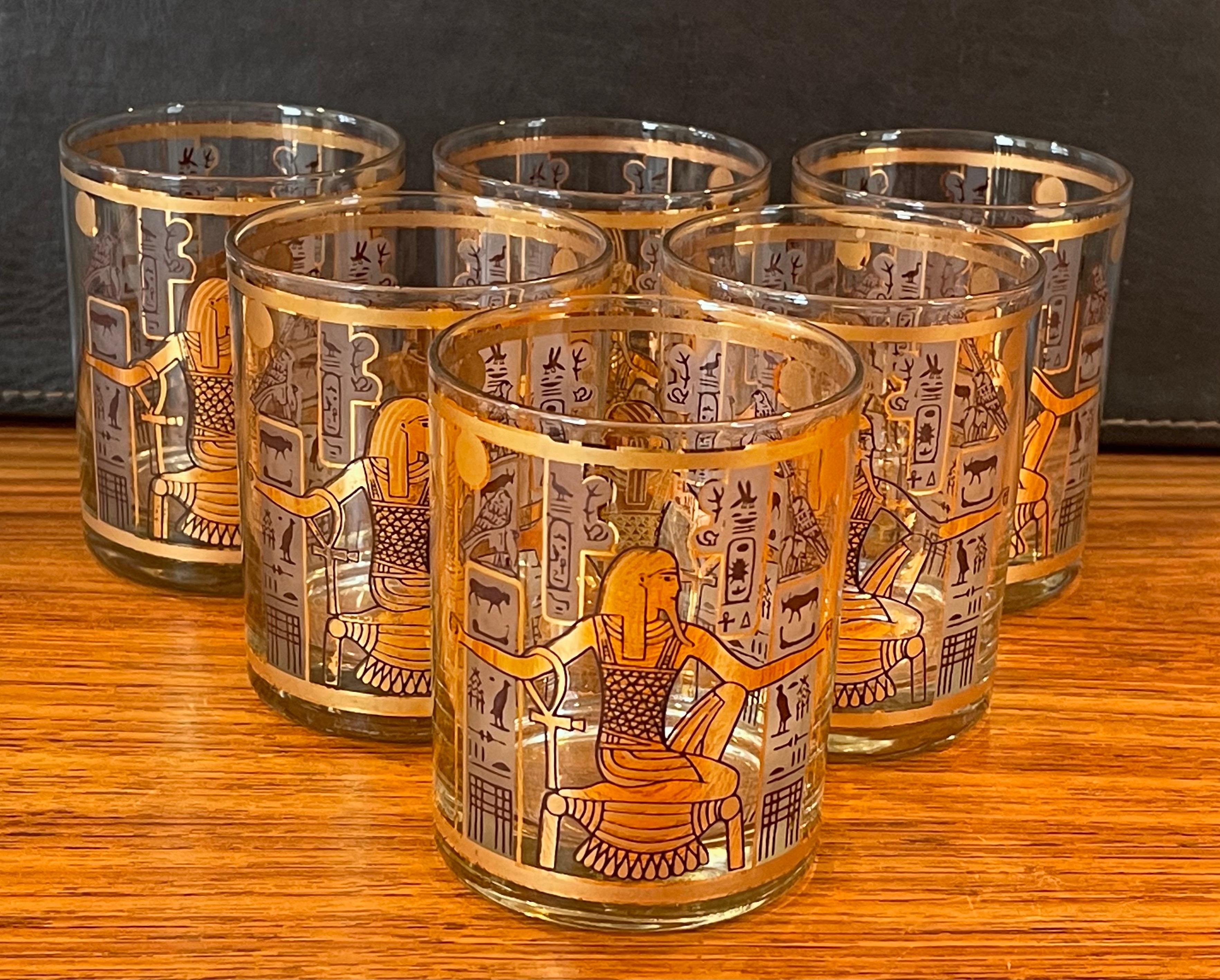 Fantastic set of six Egyptian style double old fashion cocktail glasses emblazoned with 22-karat gold artwork of pharaoh and cartouches by Culver Ltd., circa 1970s. The glasses are in very good condition with no cracks or chips and graphics are