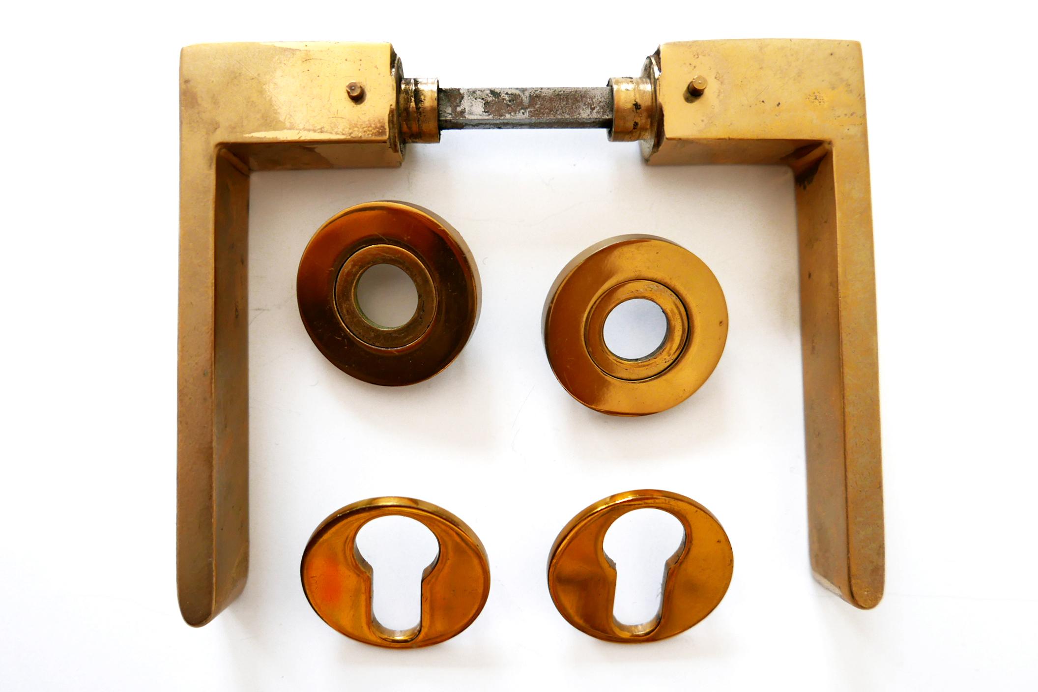 Set of six minimalistic and elegant Mid-Century Modern door handles. Designed and manufactured probably in 1950s, Germany. Executed in massive brass.

Dimensions: 0.86 x 4.72 x 5.52 in. / 2.2 x 12 x 14 cm

All six sets are complete, in very good