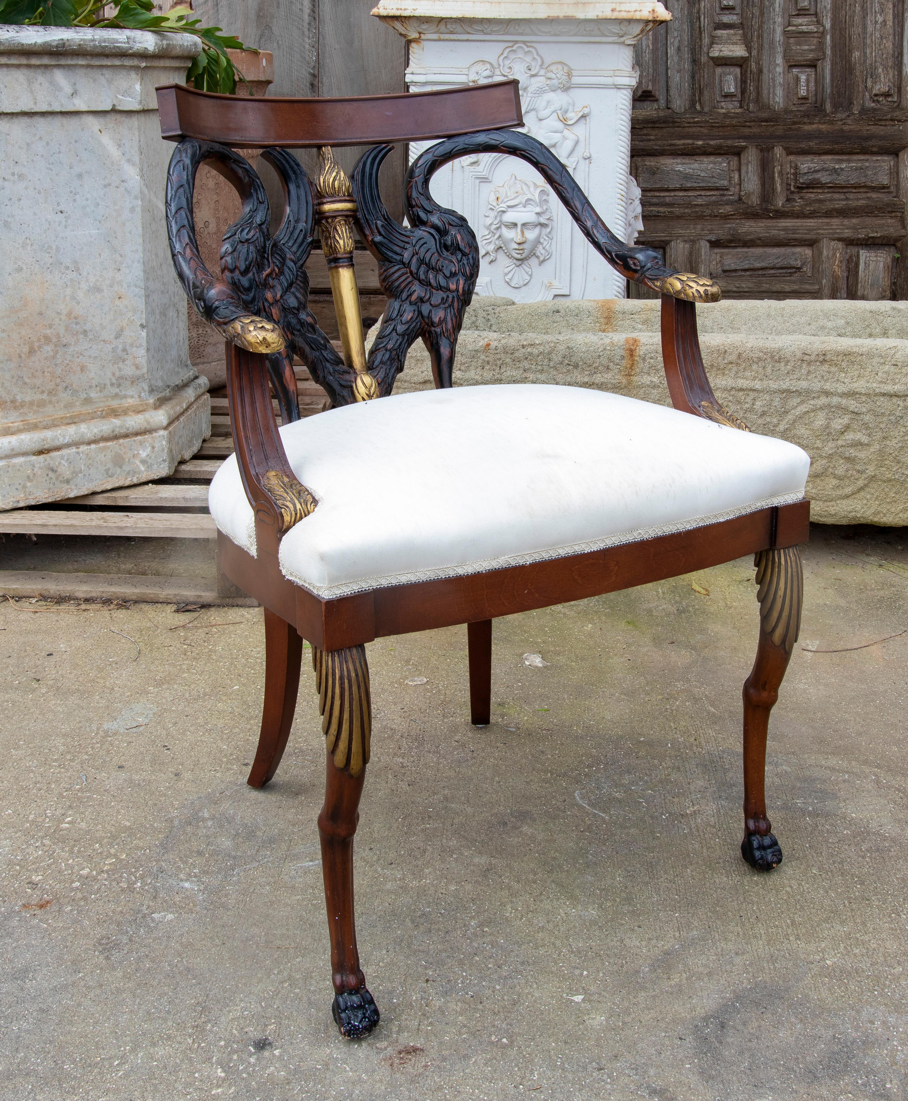 Set of six Empire Style mahogany armchairs with duck back and armrests.