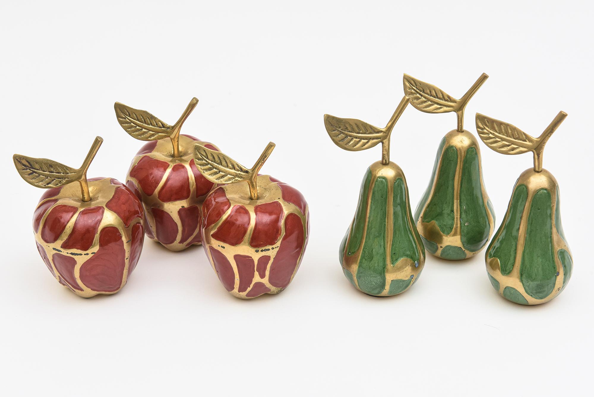 This lovely set of 6 enameled and brass apple and pear object sculptures makes for great entertaining and table settings. They are vintage from the 70's. Well made. Sold as a set of six only! There are 3 of each fruit. These will make a great