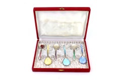 Set of six enameled teaspoons in different colors in original satin case