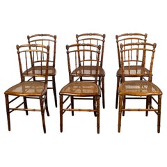 Ensemble de six chaises d'appoint anglaises 1900 en faux bambou et noyer à assise cannée
