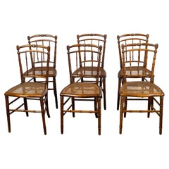 Ensemble de six chaises d'appoint anglaises 1900 en faux bambou et noyer à assise cannée