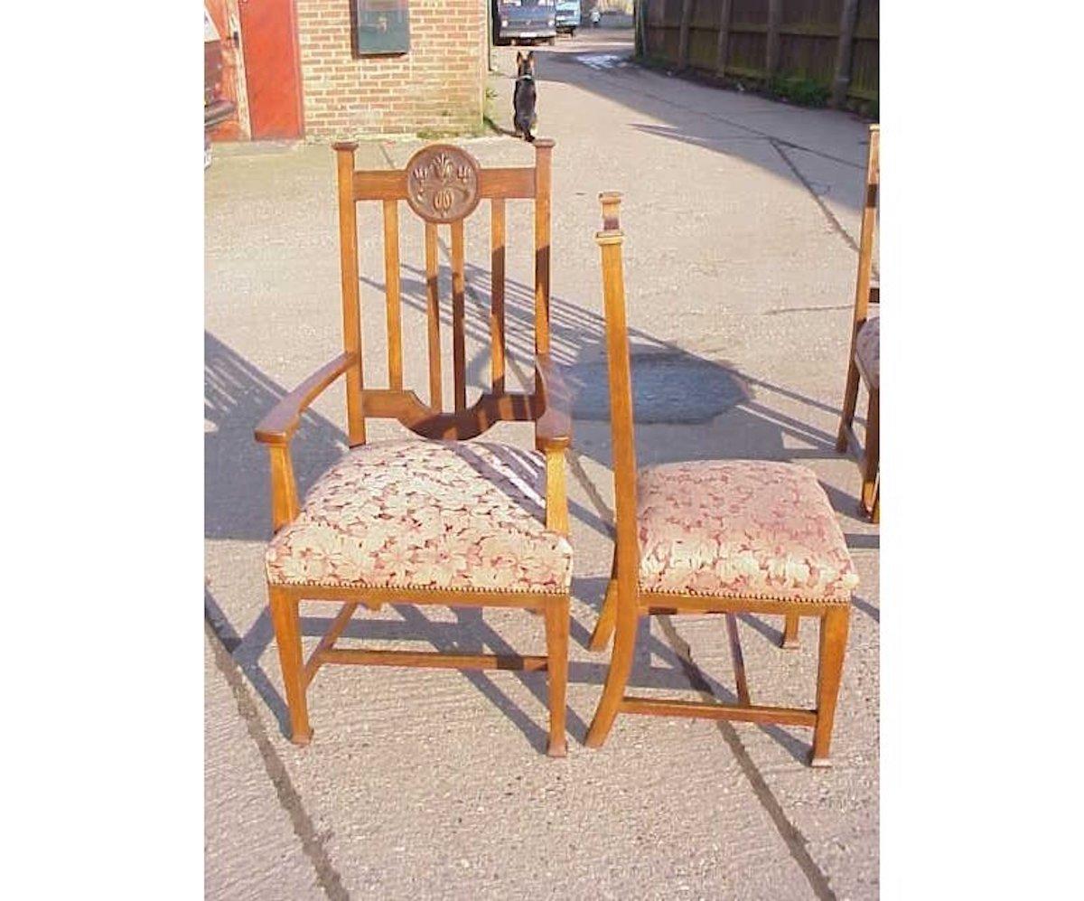 A good quality sound and sturdy set of six English Arts & Crafts oak dining chairs with carved floral roundels to the headrests.
Armchair measures Height 46 Inches. Depth 23 Inches. Width 24 Inches.
 