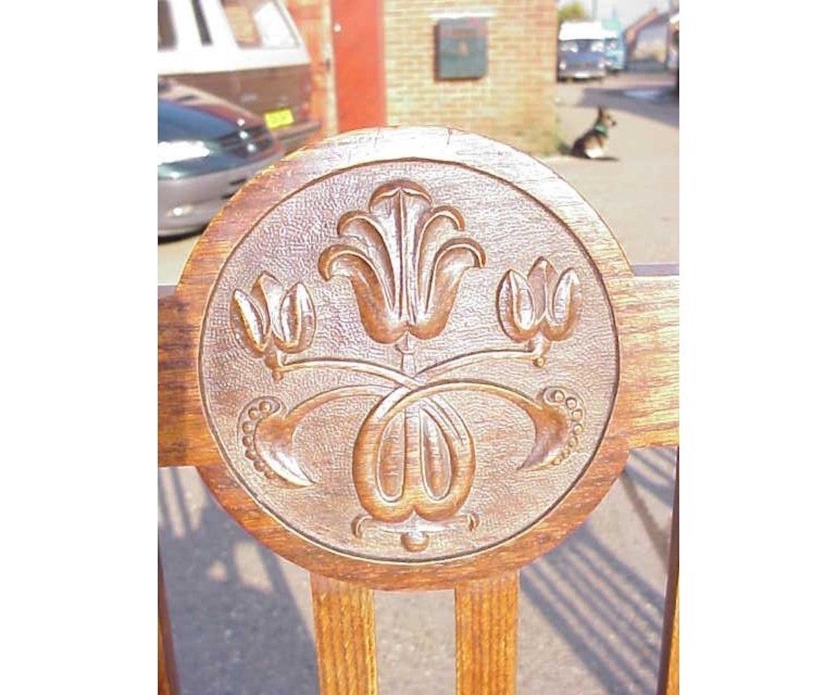 Hand-Carved Set of Six English Arts & Crafts Oak Dining Chairs with Carved Floral Roundels For Sale