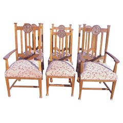 Set of Six English Arts & Crafts Oak Dining Chairs with Carved Floral Roundels
